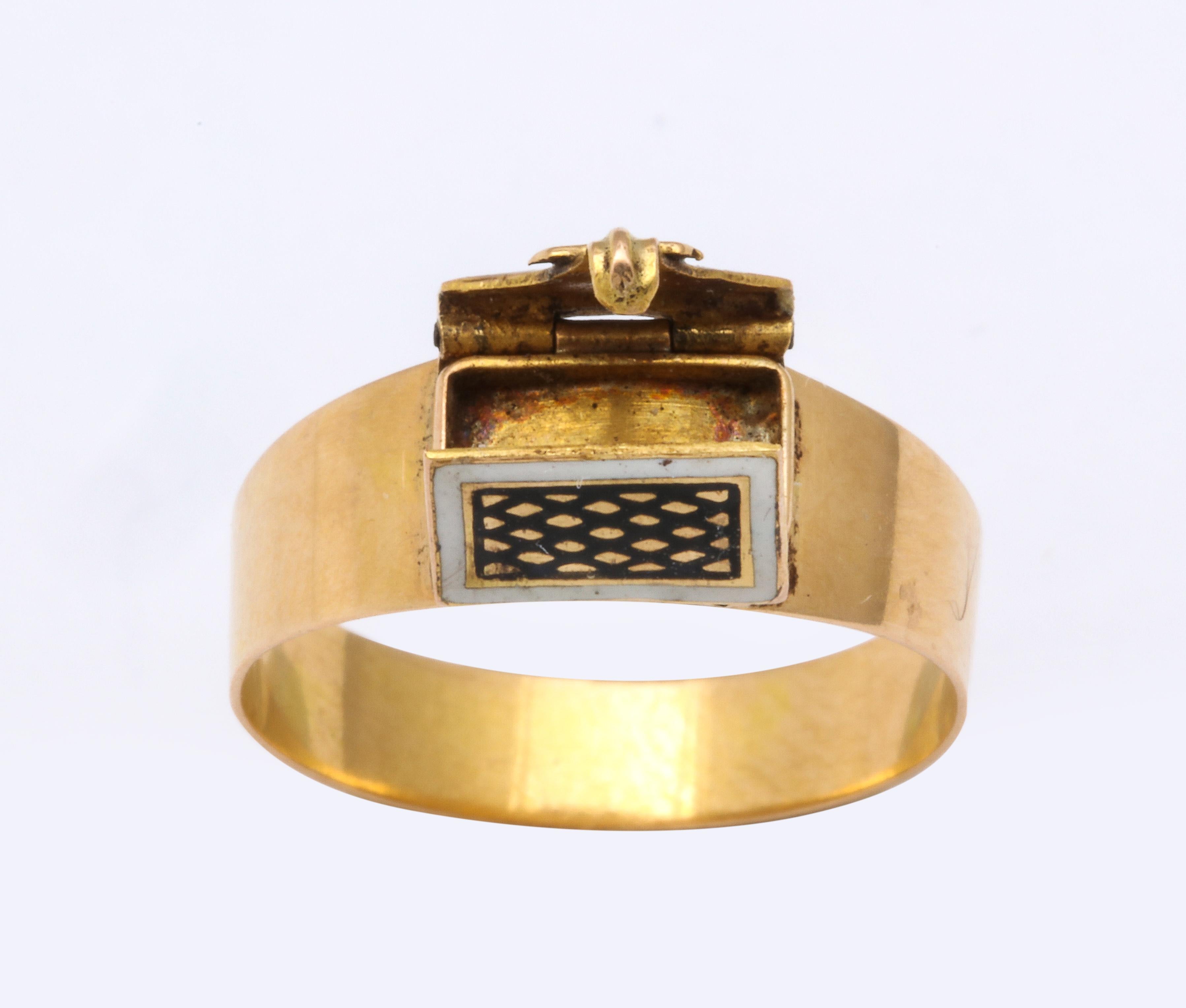 A rare ring indeed with an enamel and gold little unlocking envelope on the face of a 15Kt gold shank. Flip open the envelope and there is an empty small box. The ring is Georgian made between c.1811 and 1820, quite early. The envelope is framed in