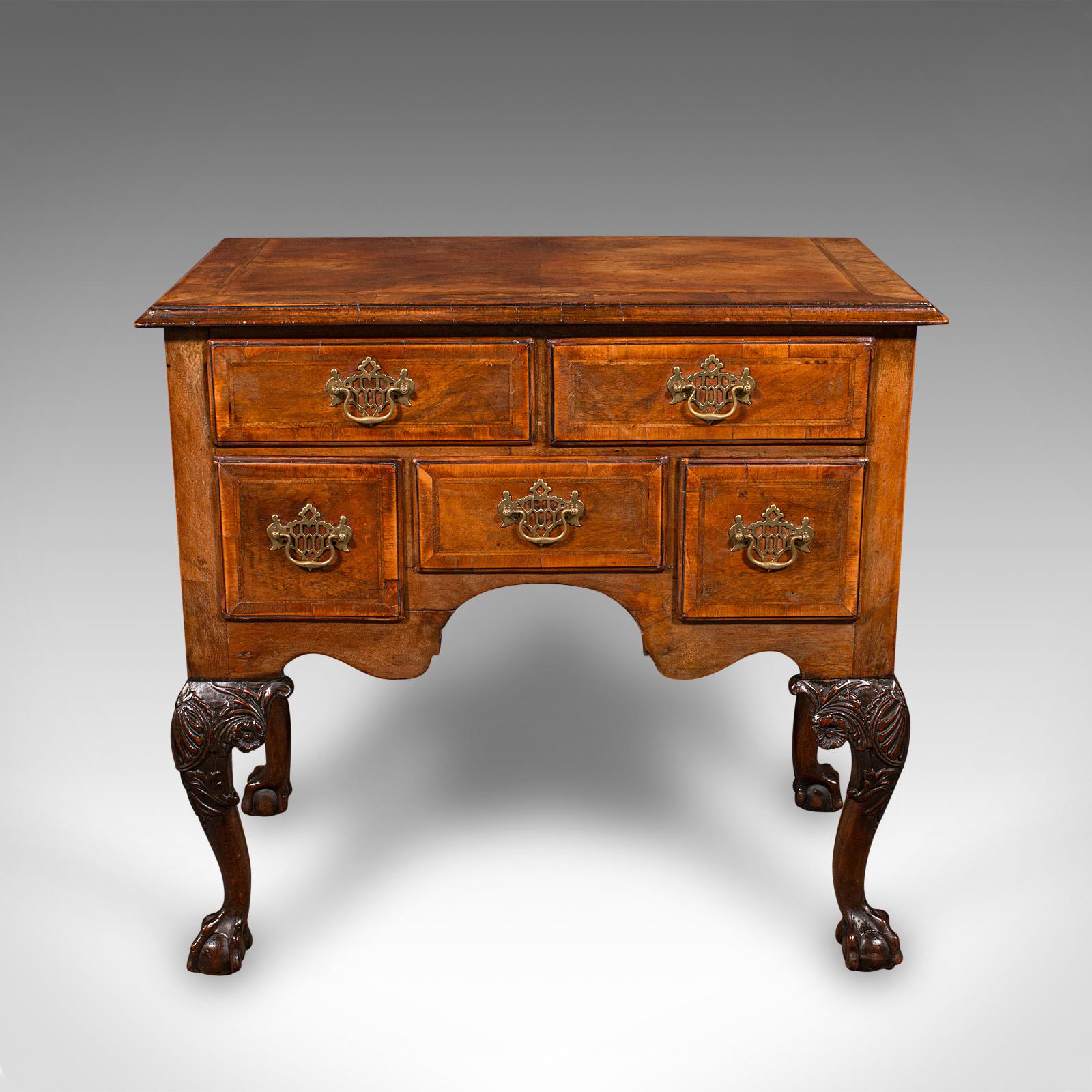 This is an antique Georgian Revival lowboy. An English, walnut hall or side table, dating to the Edwardian period, circa 1910.

Appealing Georgian Revival lowboy with attractive proportion and craftsmanship
Crafted from select walnut stocks