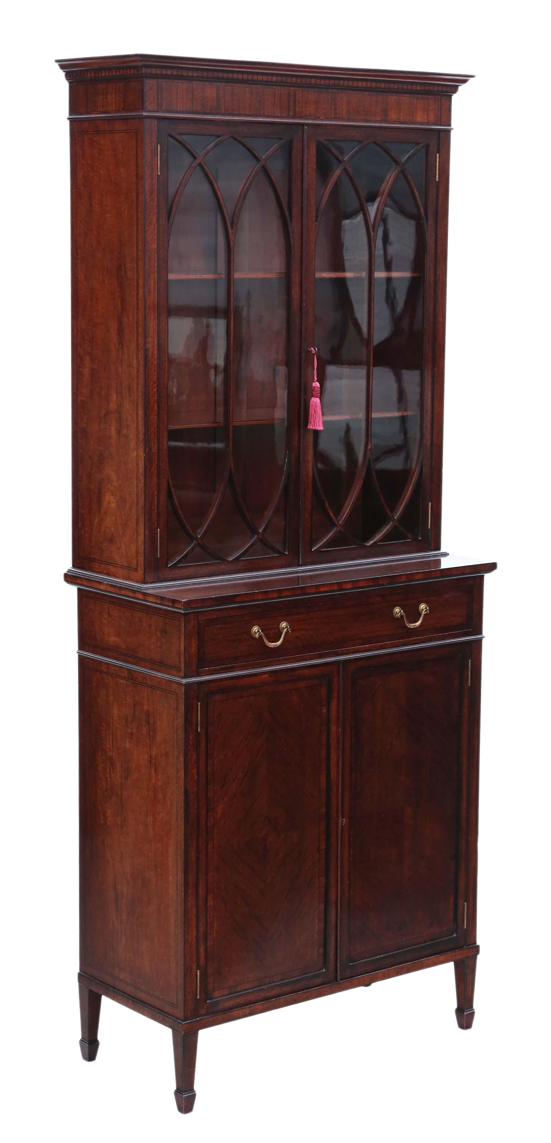 Antique fine quality 19th century Georgian revival mahogany glazed bookcase on cupboard, circa 1890.

Compact sought after size. We have a key for the top and bottom doors.

Finest quality 'plum pudding' mahogany veneers in great condition, with