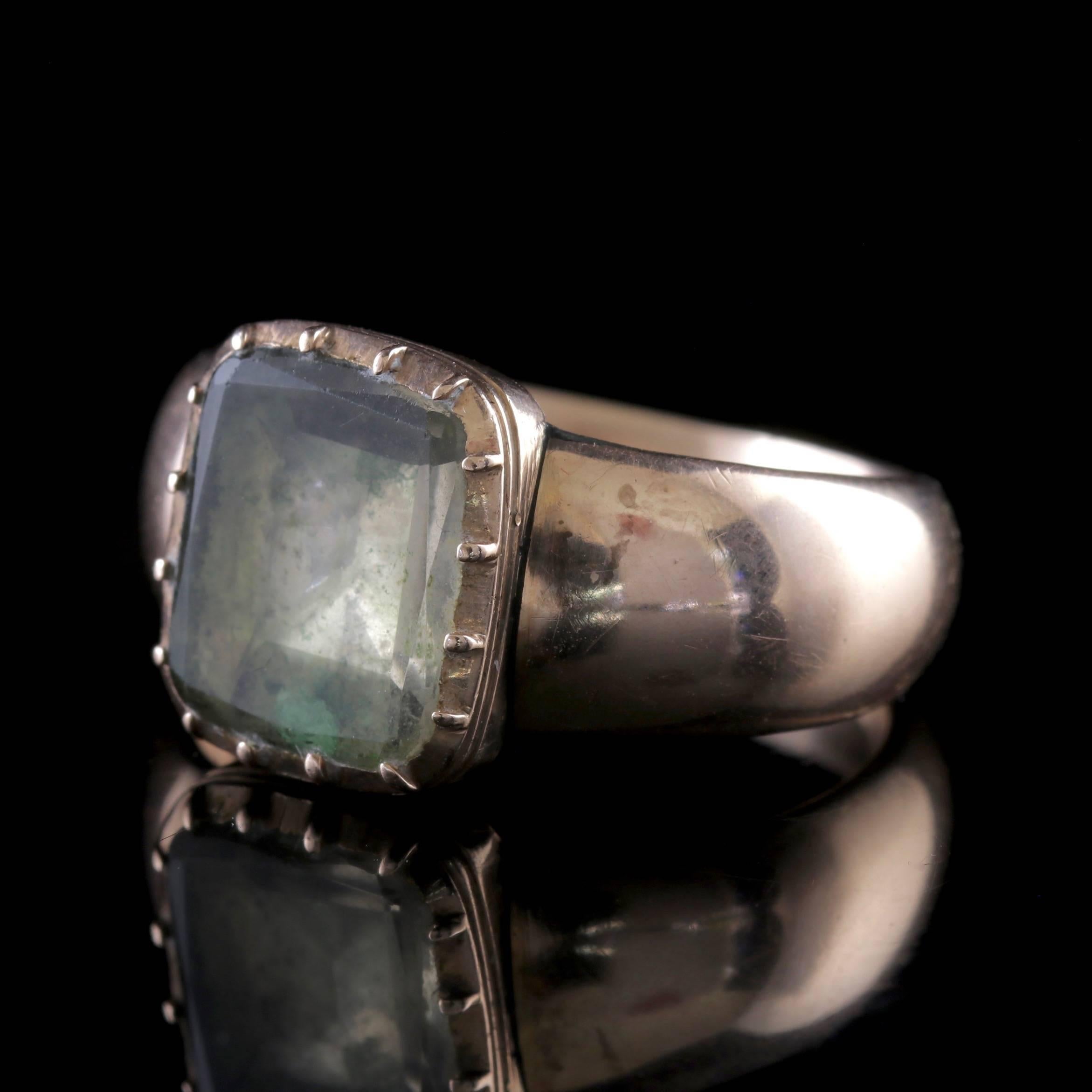 A grand antique Ring from the Georgian era adorned with a foil backed Rock Crystal which is a clear colourless form of Quartz that is highly durable and once believed by ancients to be a form of solidified ice that could never be thawed. 

The stone