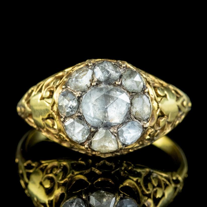 A grand antique Georgian diamond cluster ring beautifully preserved from the early 1800s. It features a glittering rose cut diamond in the centre (approx. 0.70ct) with eight smaller rose cuts haloing it (approx. 1.5ct total).

The rose cut has been