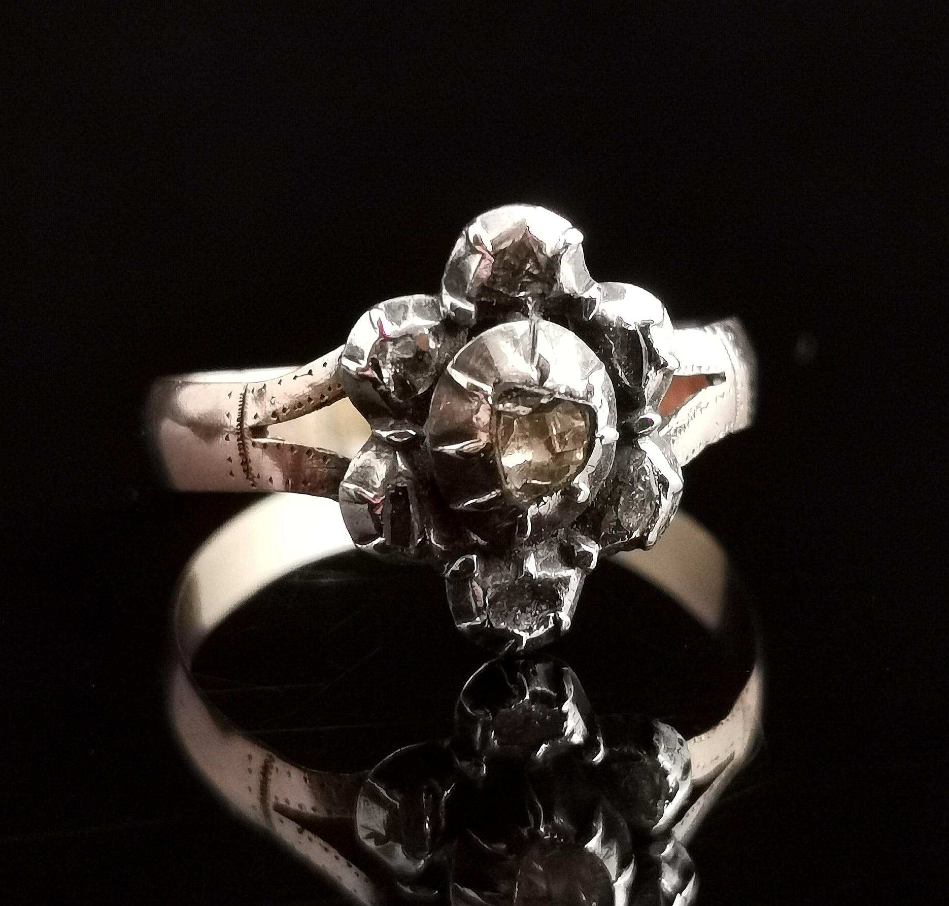 A charming antique Georgian rose cut diamond navette shaped ring.

This ring has obviously had quite a life and it is showing some scars and wear but if you can look past its flaws you have a ring full of old charm and character.

A navette shaped