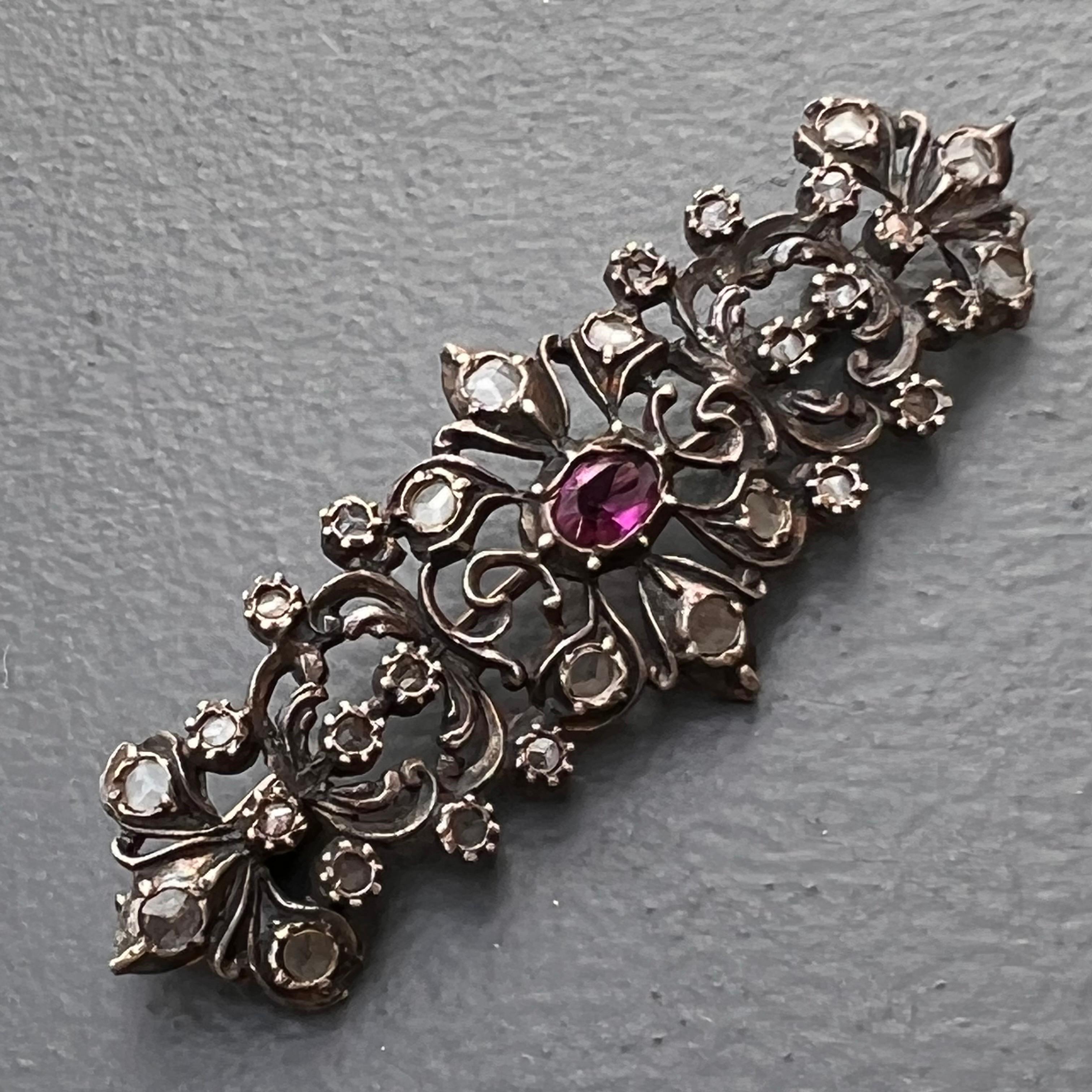 Antique Dutch Georgian /early Victorian Rose cut white Sapphire Amethyst Pin / Brooch  set on an gold backed on silver with open work design . This kind of technique was very common in antique  jewelry containing precious stones as it was believed