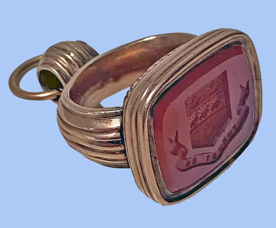 Antique Georgian rose Gold and Carnelian Seal Fob C.1820. The carnelian seal engraved with coat of arms and motto for Thurston...Thrust on. Measures: 1.50 x 1.00 x 0.75 inches. Item Weight: 17.66 grams. Gold acid tested 10K. Condition Good.