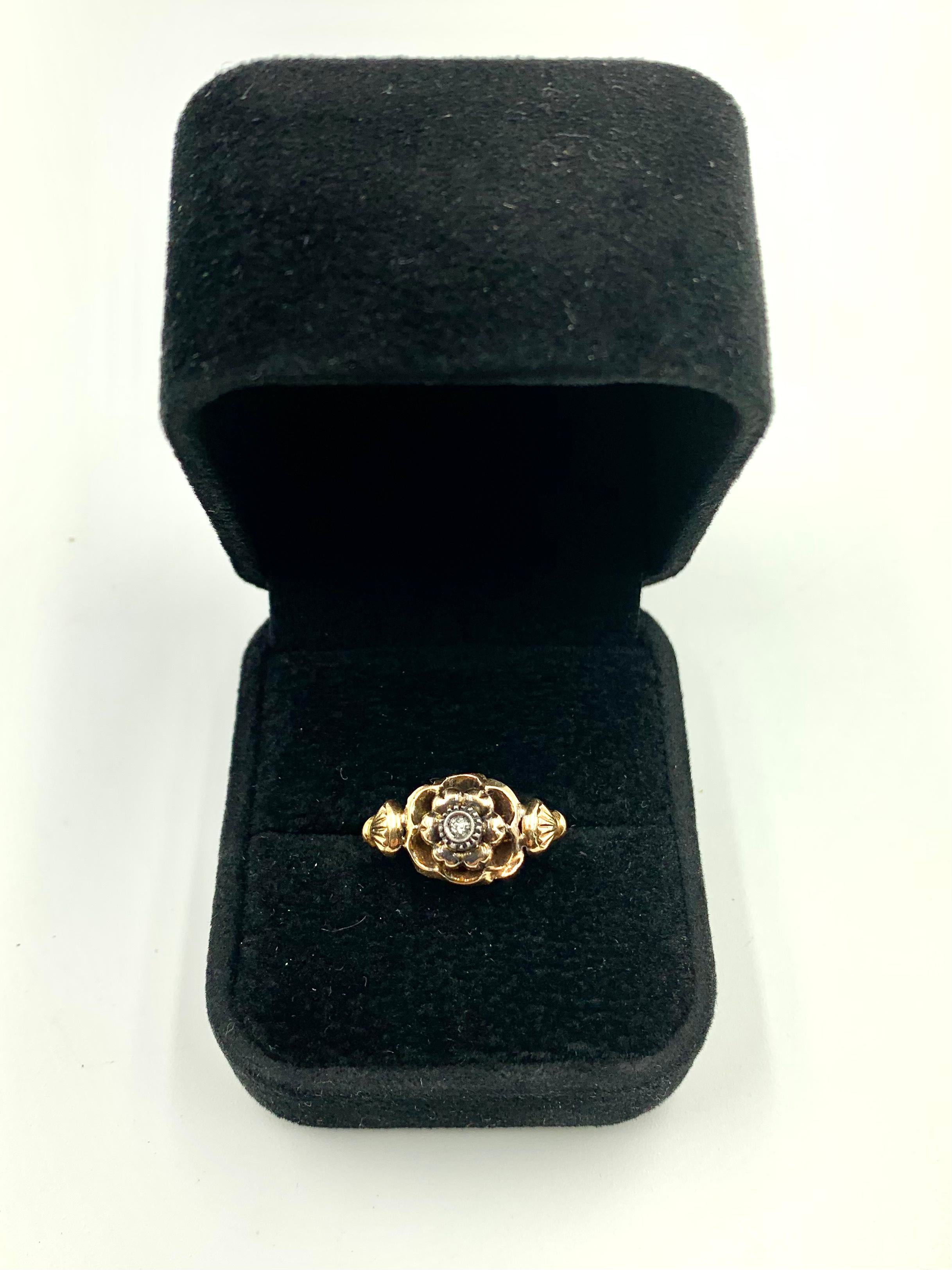 Fine antique Georgian period Rose Ring, the central mount n the shape of a rose in full bloom with a rough cut diamond center, flanked by unusual sea scallop shaped design elements.
Roses symbolize love, romance and beauty. The sea scallop is