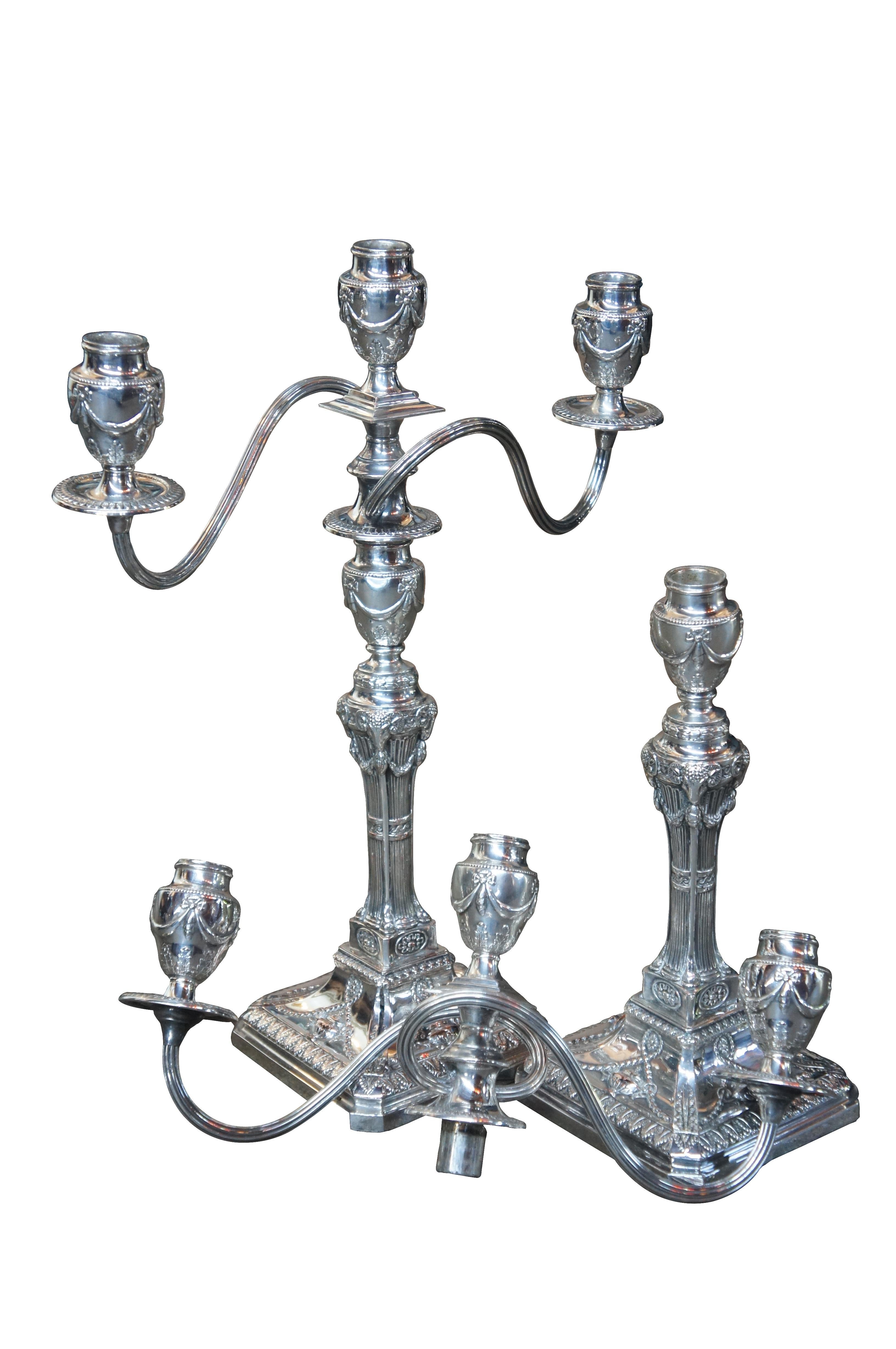Antique Georgian silver plate candelabra English candlesticks rams head MS Rau

This beautiful antique pair of silver plate candelabras was purchase in New Orleans from M.S Rau antiques, circa1990s.
Highly engraved, featuring trophy's, scrolled