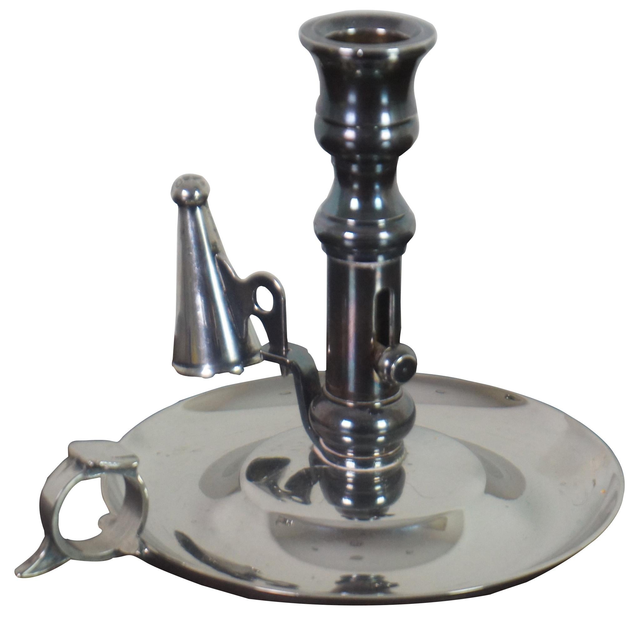 Antqiue English Georgian silver plate chamber candlestick with ring handle, snuffer, and push up mechanism to raise the candle as it burns down.
 