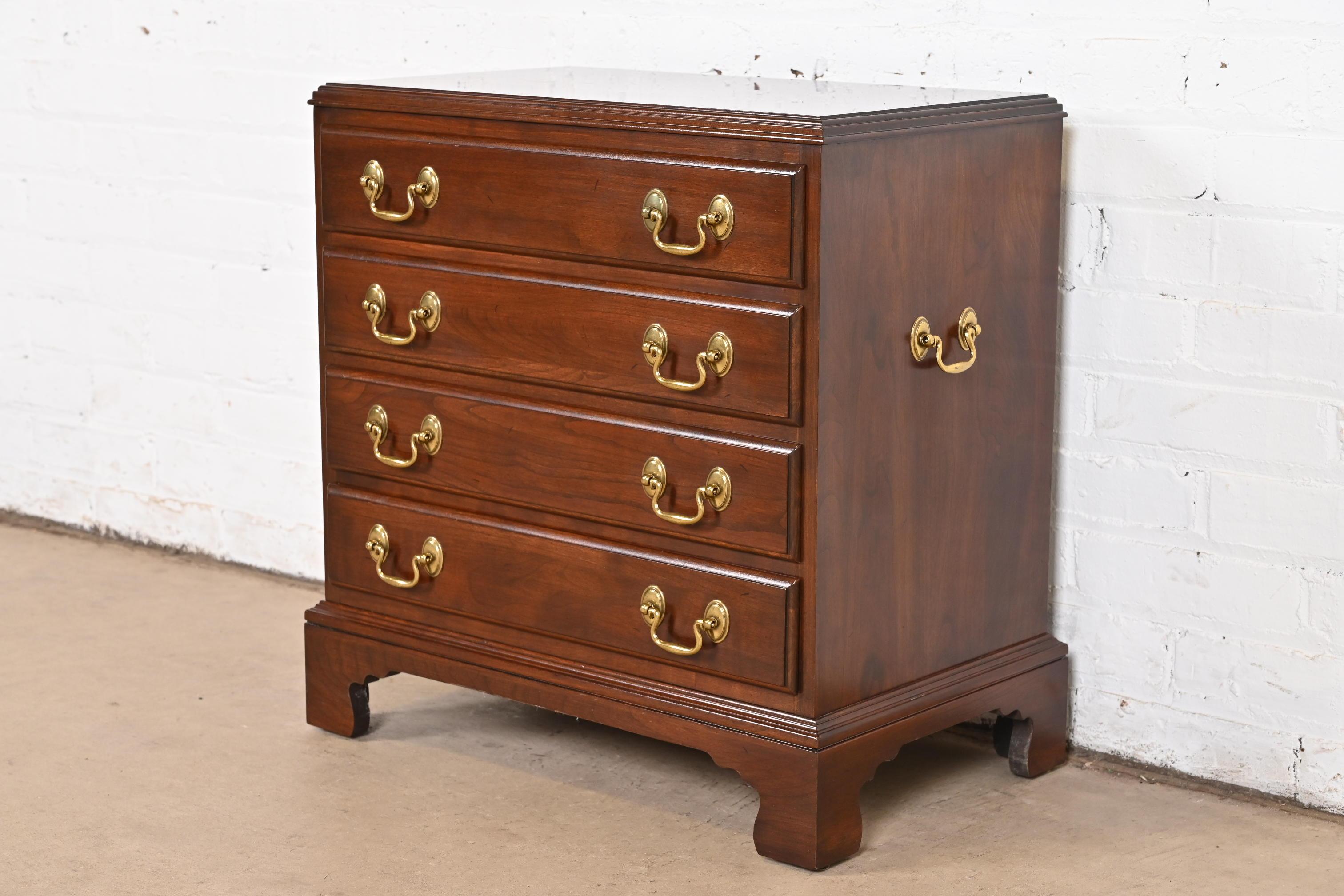A gorgeous Georgian or Chippendale style four-drawer bachelor chest or nightstand

USA, Late 20th Century

Solid cherry wood, with original brass hardware.

Measures: 22