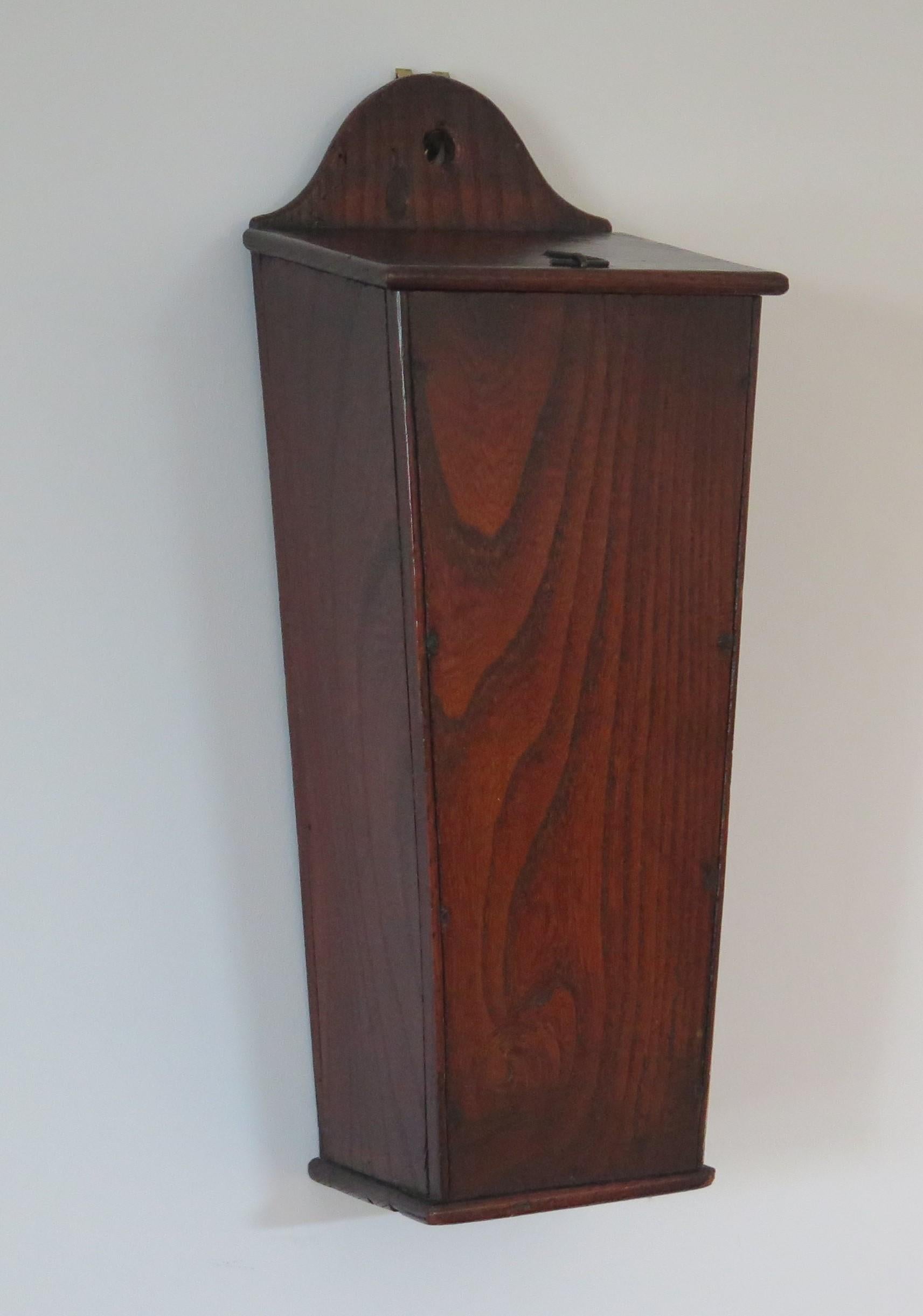 A very good example of a country candle box that could be found in many country cottages during 18th Century England.

This is a particularly good example, not fussy, but utilitarian in its construction. The piece is made of solid elm that has