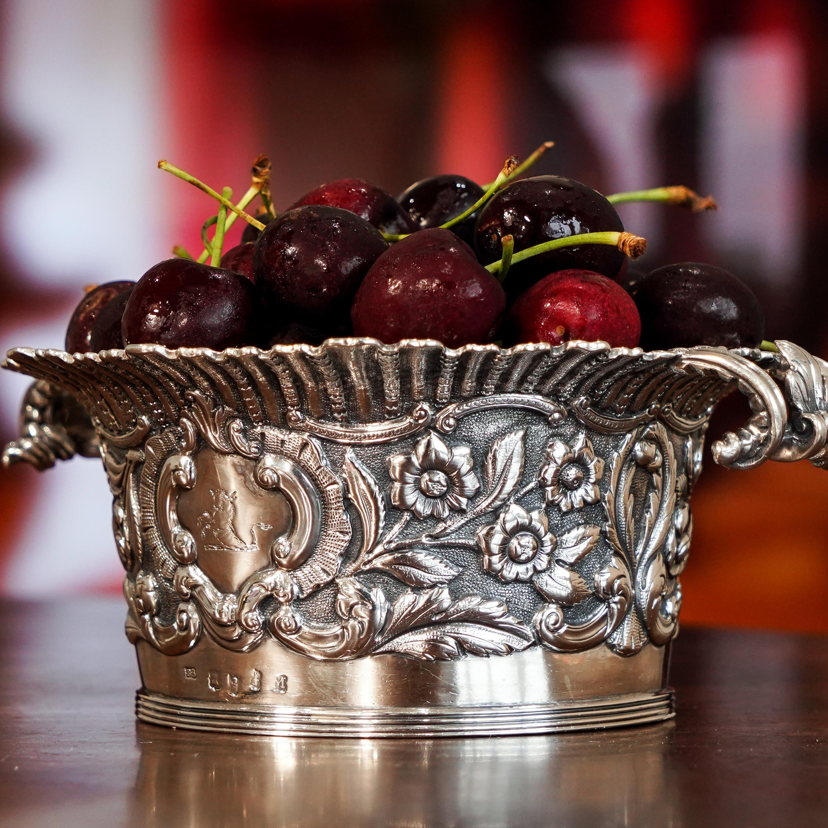 We are delighted to offer this Irish Georgian solid silver bowl with the marks of Robert W Smith, Dublin, 1832.
   
This bowl presents an array of exemplary and absolutely delightful features, distinctly Irish and profusely chased with floral,