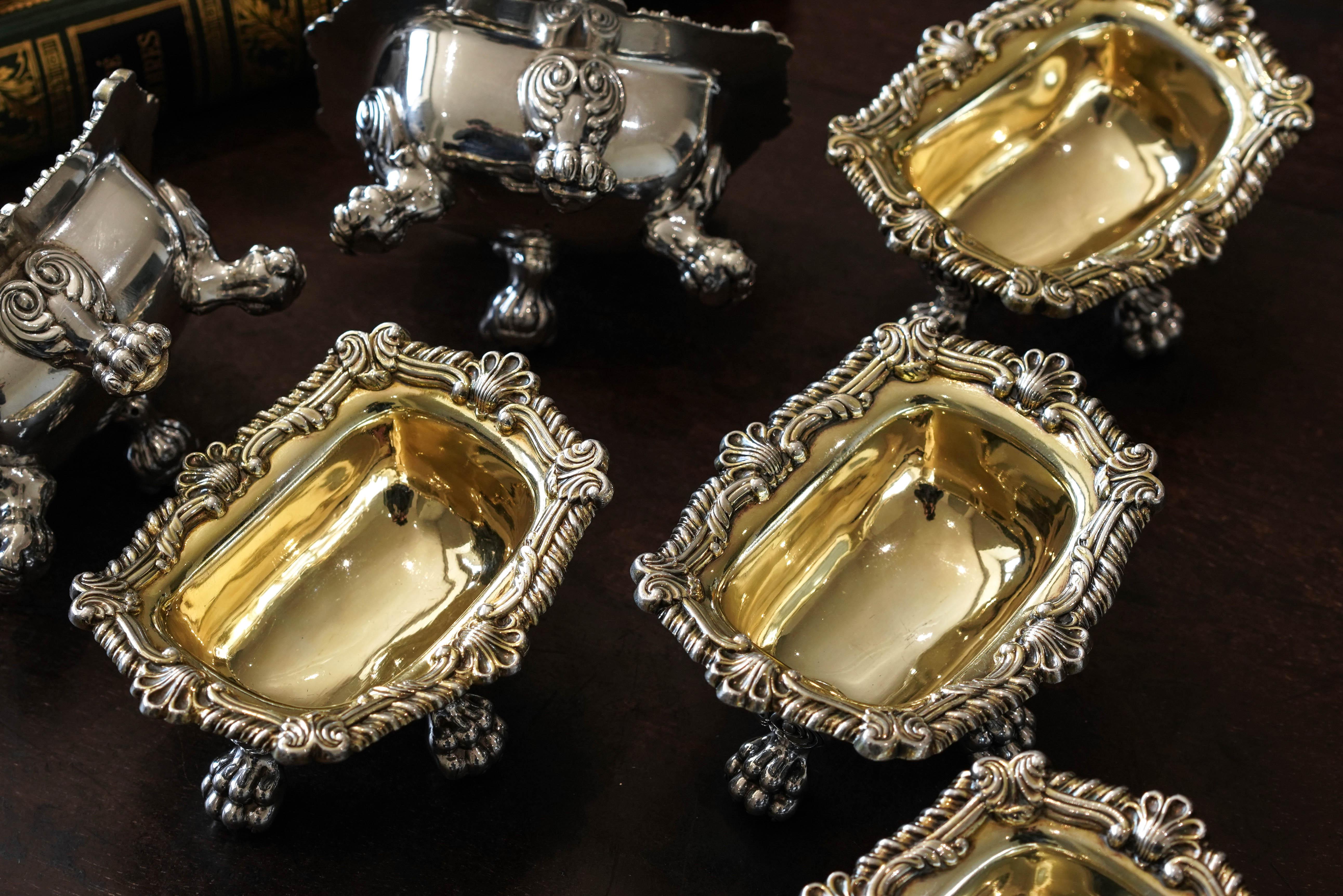 We are delighted to have acquired and offer this magnificent set of six salt cellars made by S & C Younge & Co in Sheffield, 1814/16 (4 and 2 identical from two years later). 

The set presents a spectacular Regency design, drawing inspiration from