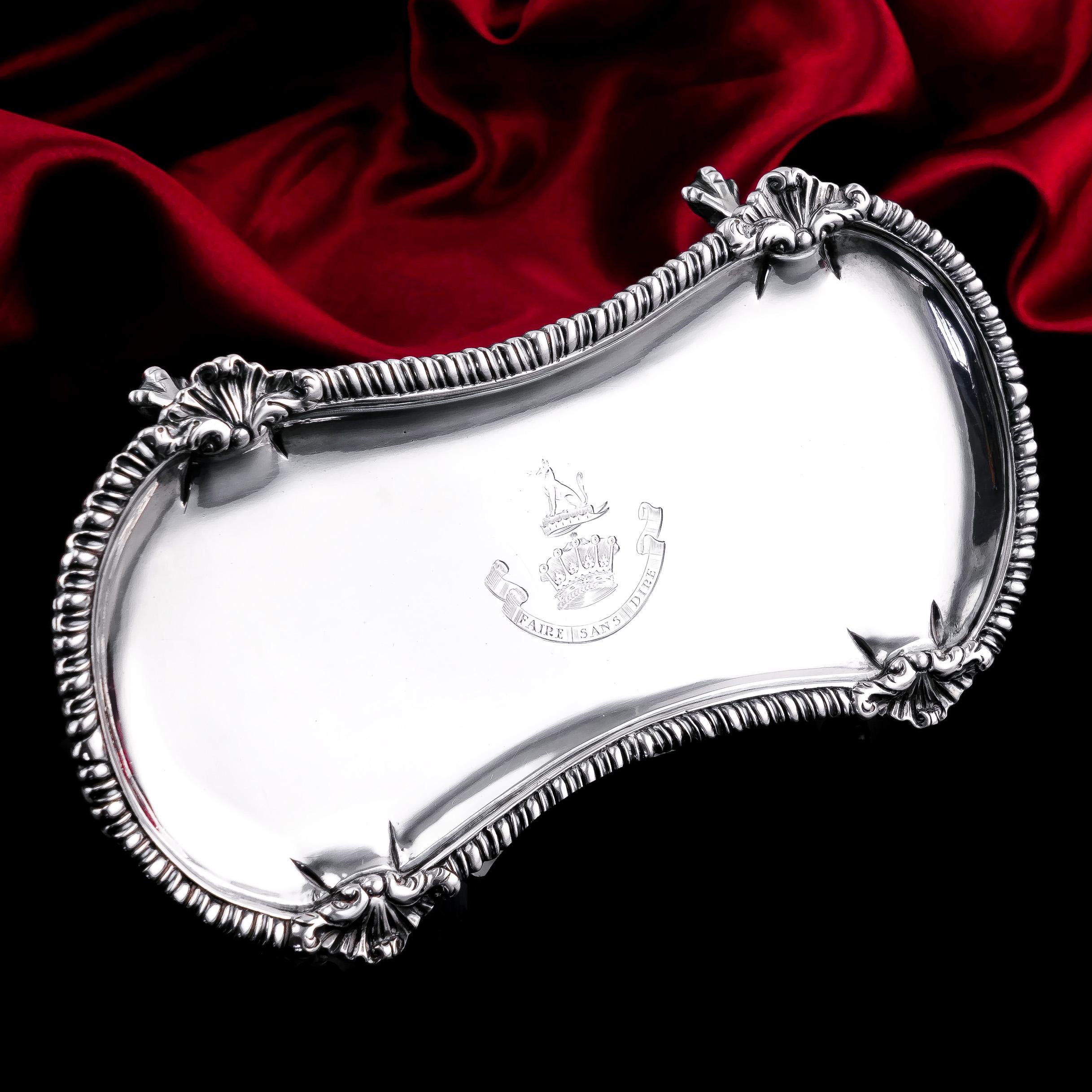We are delighted to be able to offer this wonderful solid silver snuffer tray made by Henry Hallsworth in London, 1774.
 
Featuring traditional Georgian decorations, this tray presents a wonderful hourglass shape accented with a gadrooned border