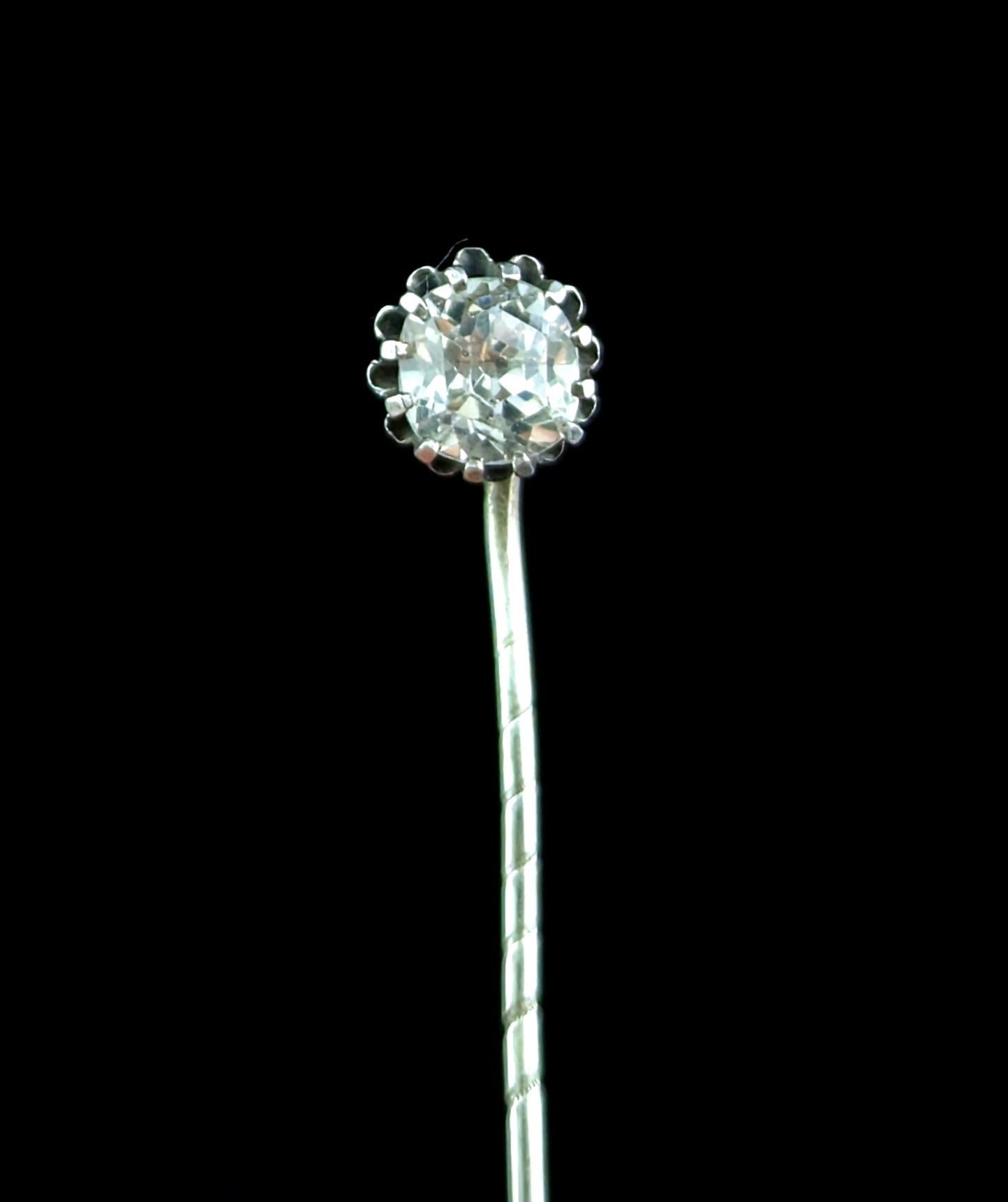 This late Georgian silver and paste stick pin can be imagined adorning a fine gentleman's cravat.

Made from sterling silver the finial golds a single sparkling clear paste stone.

The stick pin also known as a tie or cravat pin started out its