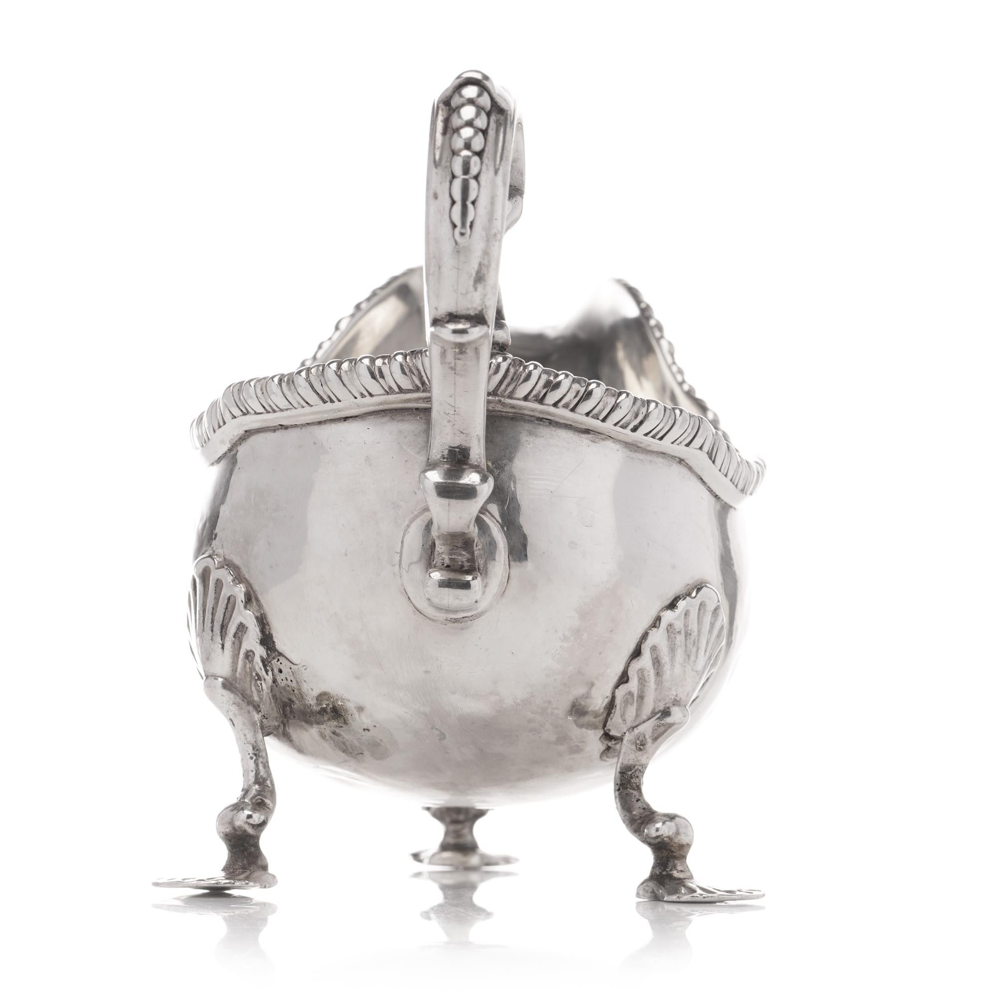 Late 18th Century Antique Georgian sterling silver chased sauce boat with elaborate decorations For Sale