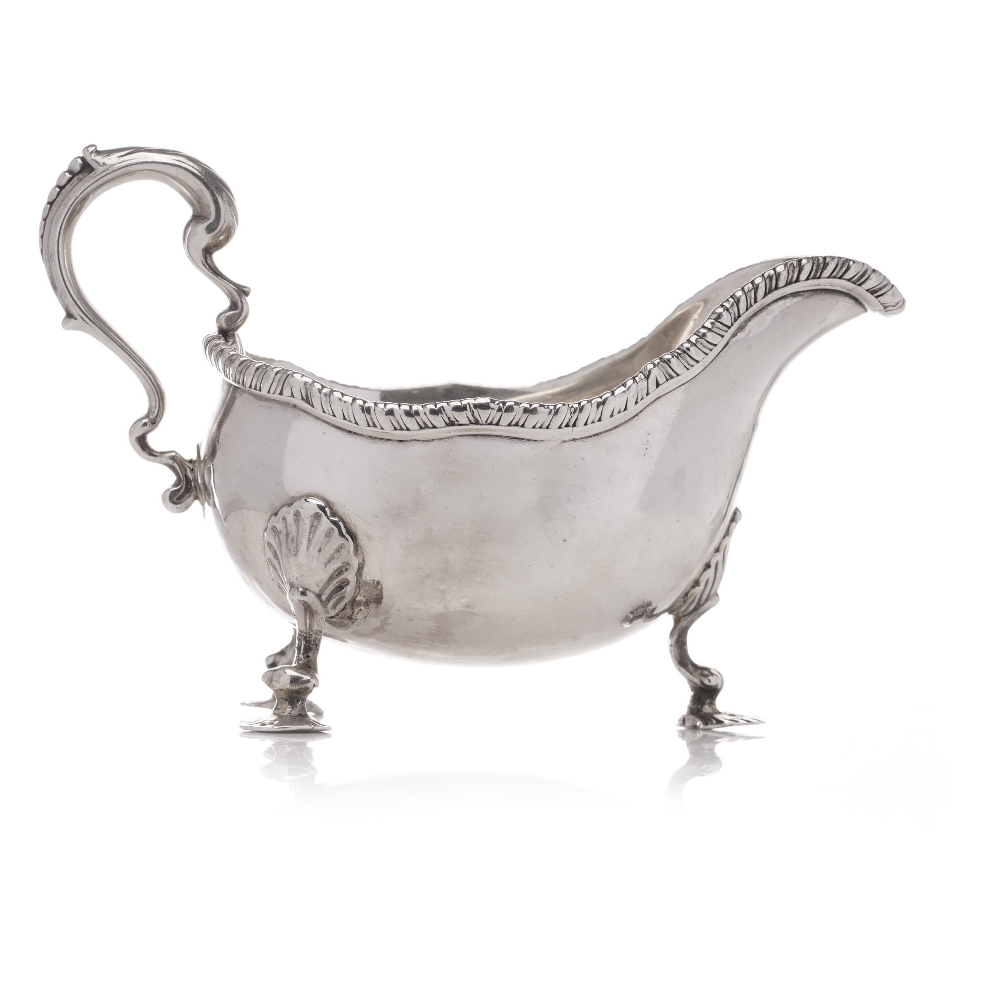 Silver Antique Georgian sterling silver chased sauce boat with elaborate decorations For Sale