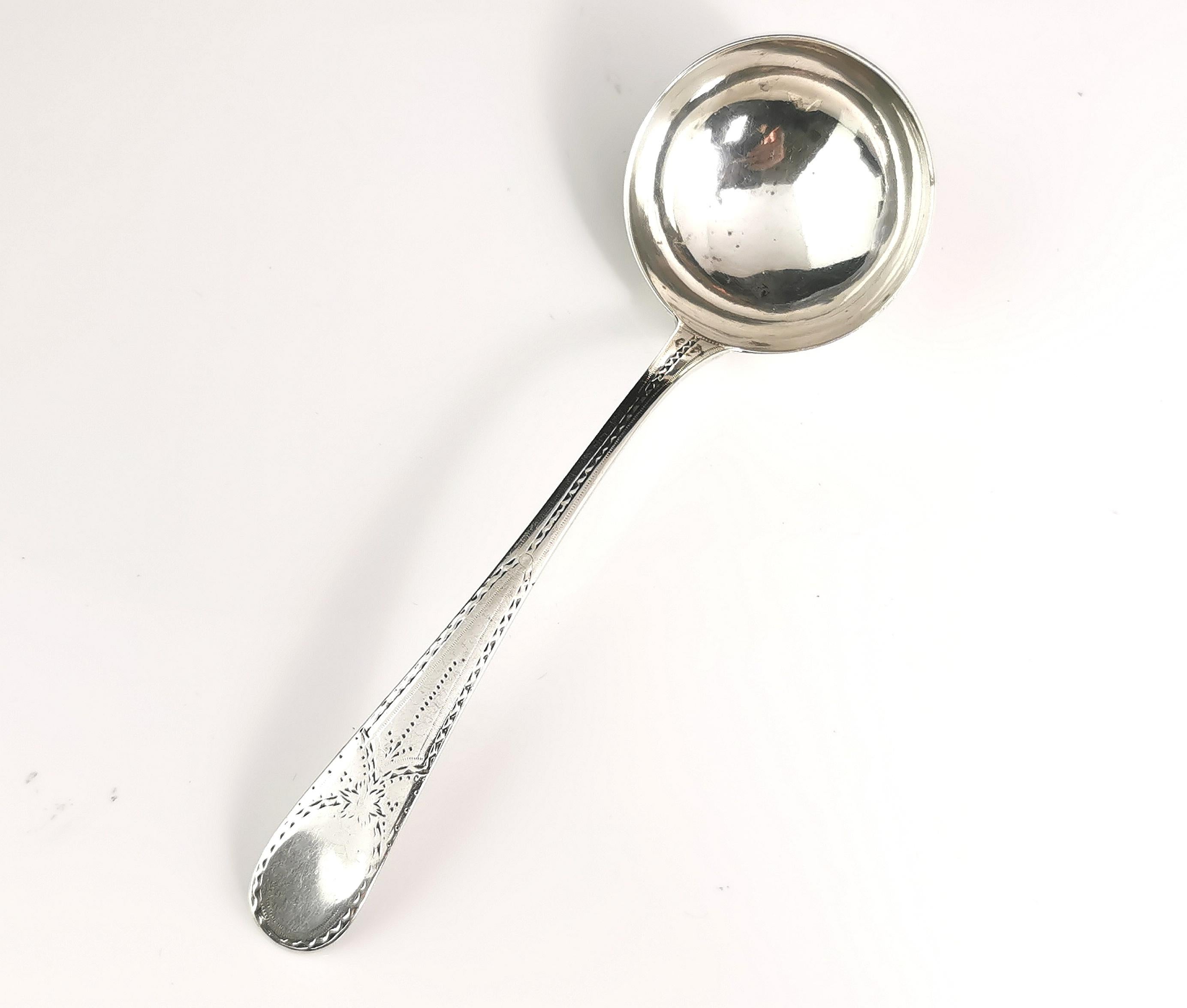 An attractive Georgian sterling silver ladle.

It has a deep round bowl with a bright cut engraved handle.

Large clear hallmarks to the reverse with a rat tail end pattern.

Nice and solid with a decent weight and strong handle, some minor