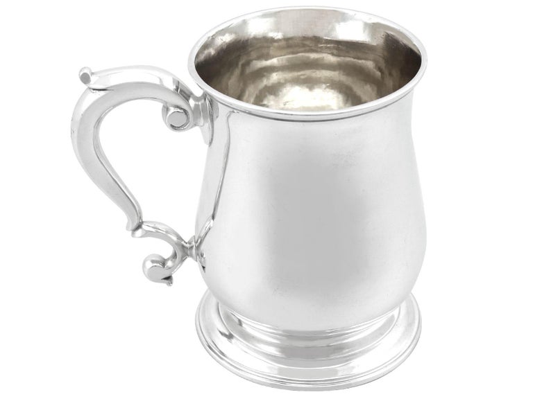 An exceptional, fine and impressive antique George III English sterling silver mug; an addition to our Georgian silverware collection

This exceptional, fine and impressive antique George III sterling silver mug has a plain baluster form onto a