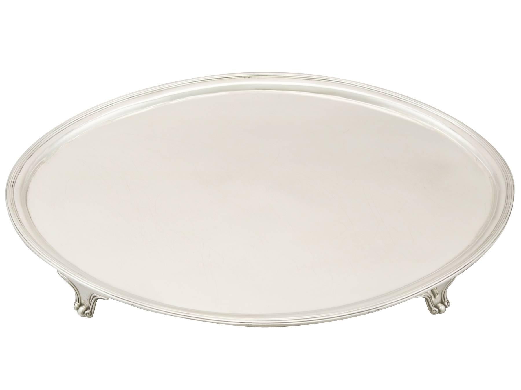A fine and impressive, large antique George III English sterling silver salver; an addition to our Georgian silverware collection

This impressive antique George III sterling silver salver has a plain oval form onto four bracket style feet.

The