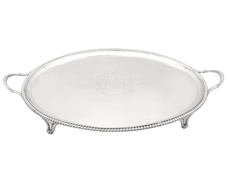 An exceptional, fine and impressive antique Georgian English sterling silver two handled tea tray; an addition to our silver tray collection.

This exceptional antique George III sterling silver tray has an oval form onto four bracket style