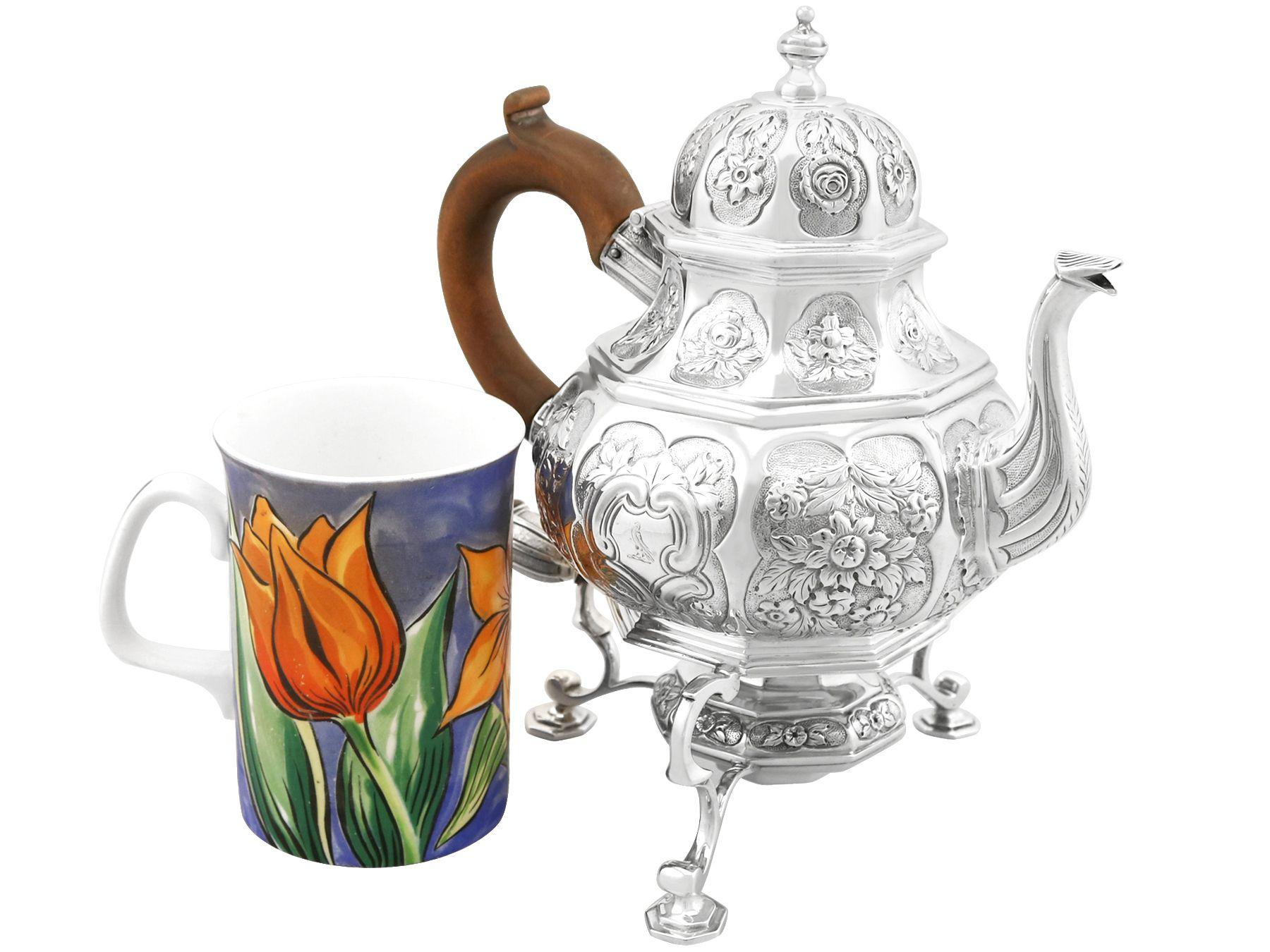 An exceptional, fine and impressive antique George III English sterling silver teapot with spirit burner made by John Cope Folkard; an addition to our Georgian silver teaware collection.

This exceptional antique George III English sterling silver