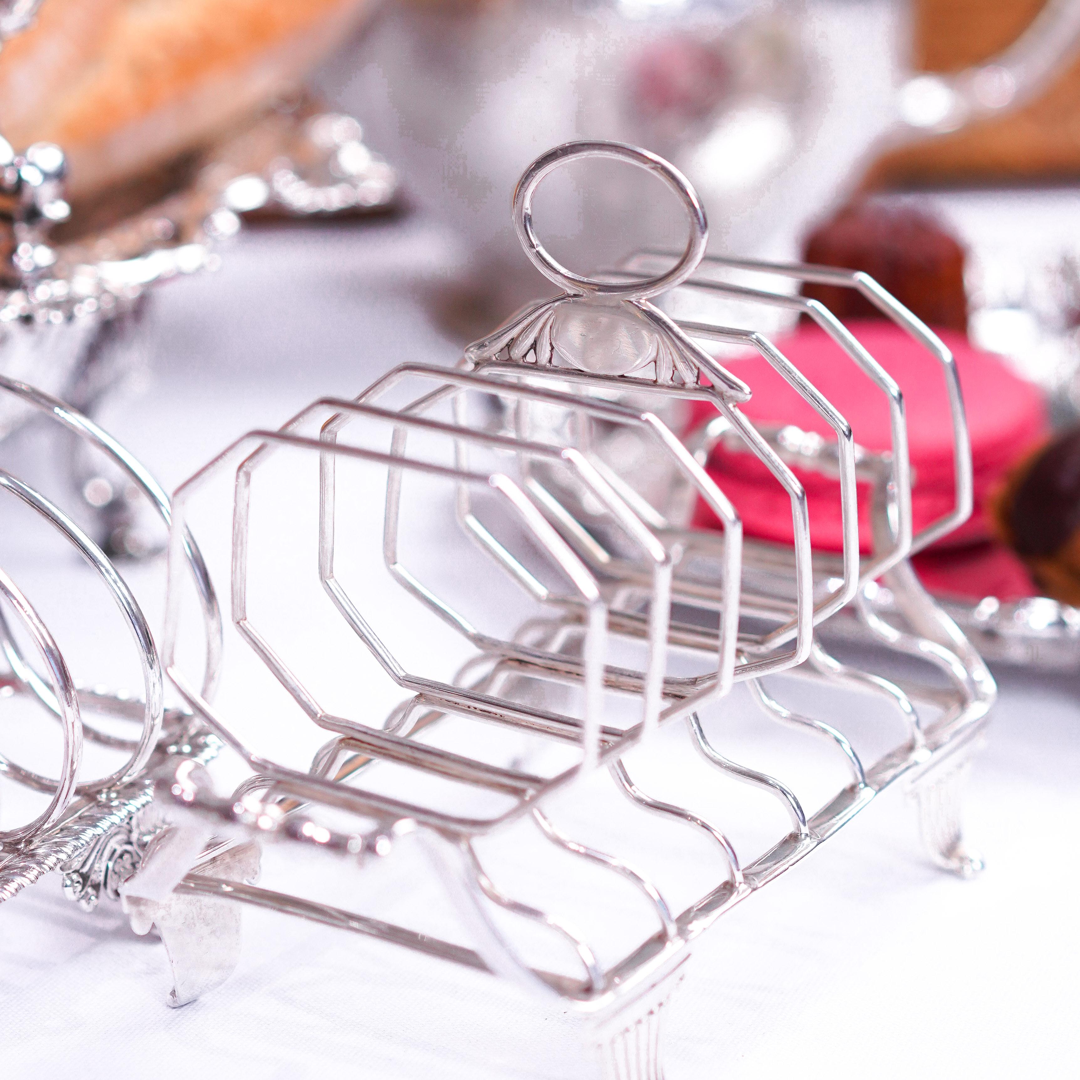We are delighted to offer this splendid and stylistically juxtaposing Georgian solid silver toast rack made in London 1809 with marks of Rebecca Emes & Edward Barnard.
 
At first glance, even to the seasoned collector, this rack may appear