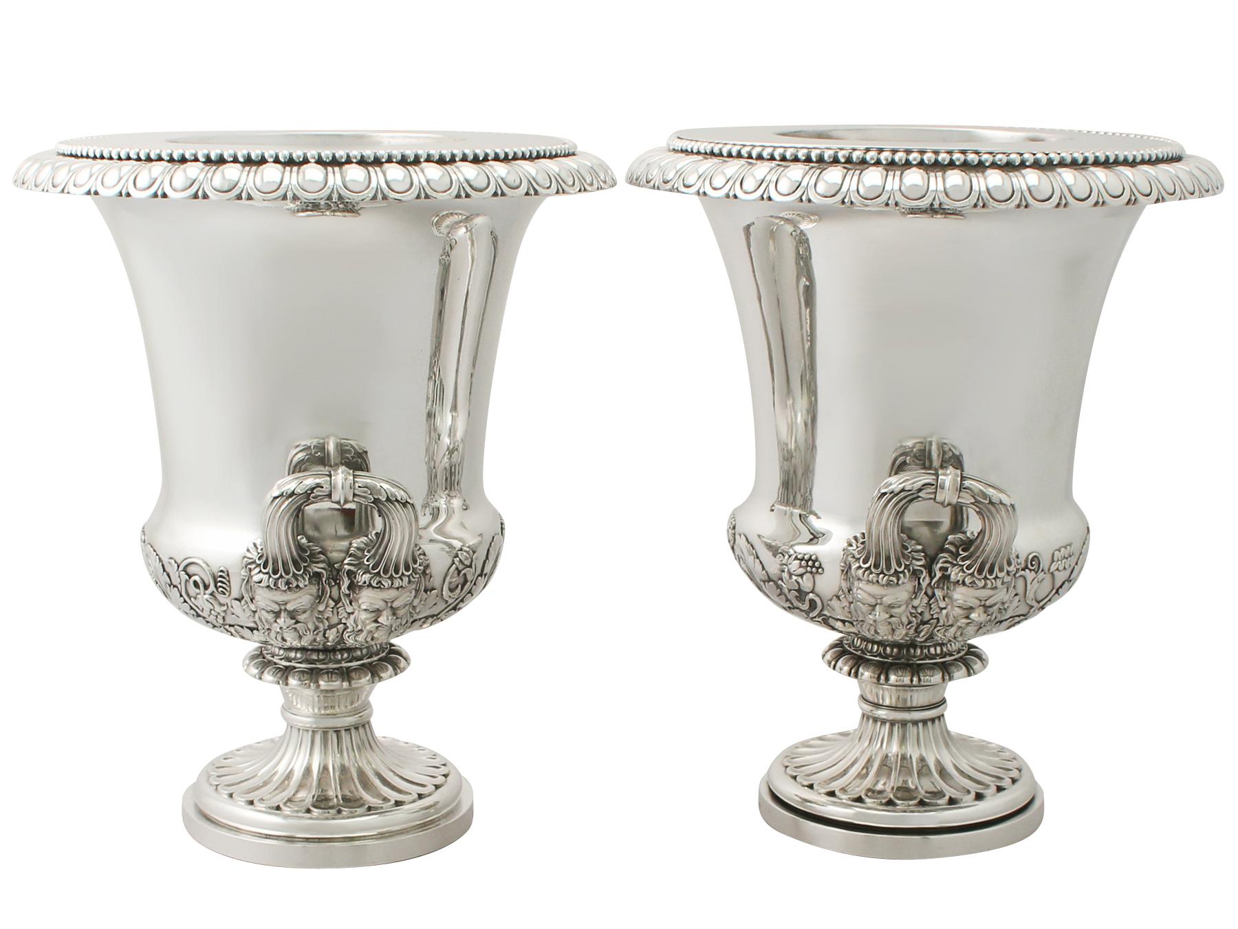 A magnificent, fine and impressive pair of antique Georgian English sterling silver wine coolers made by Benjamin Smith II & James Smith III; an addition to our antique wine and drink related silverware collection.

These magnificent antique George