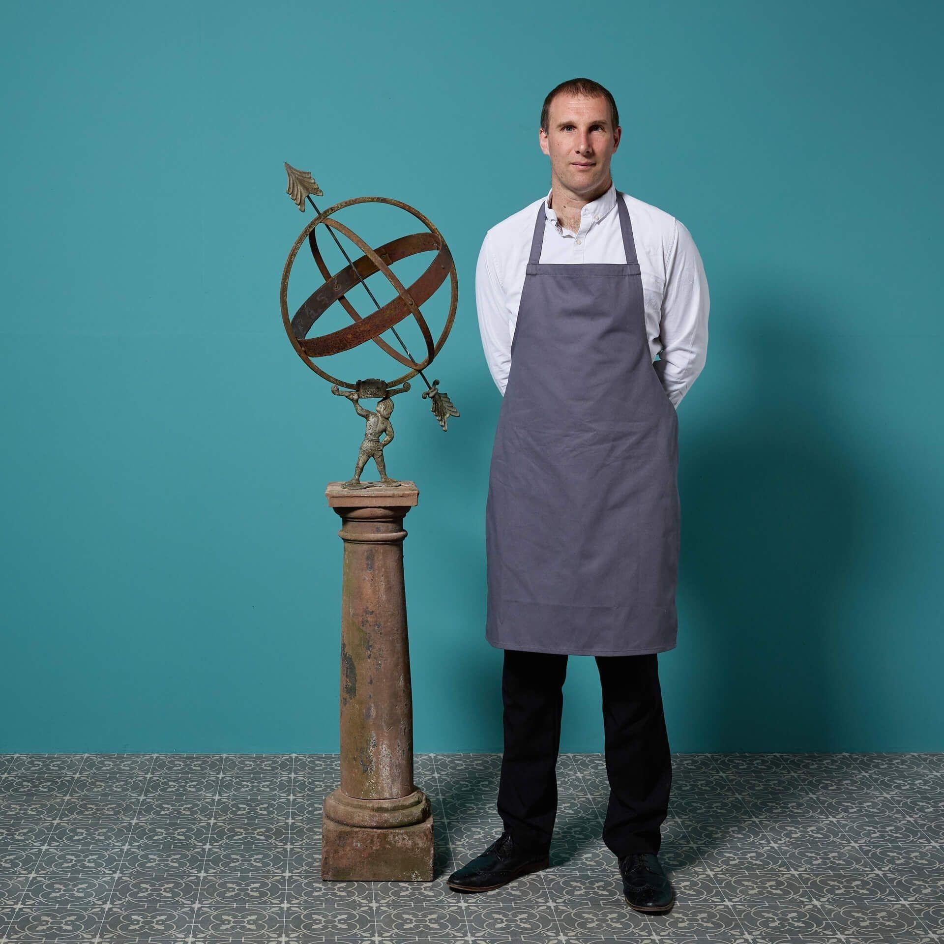 A striking antique Georgian style armillary sundial featuring an unusual 20th century armillary sphere mounted upon a beautifully weathered Georgian era red sandstone column plinth.

Certain to look stunning at the centre of a courtyard, the steel