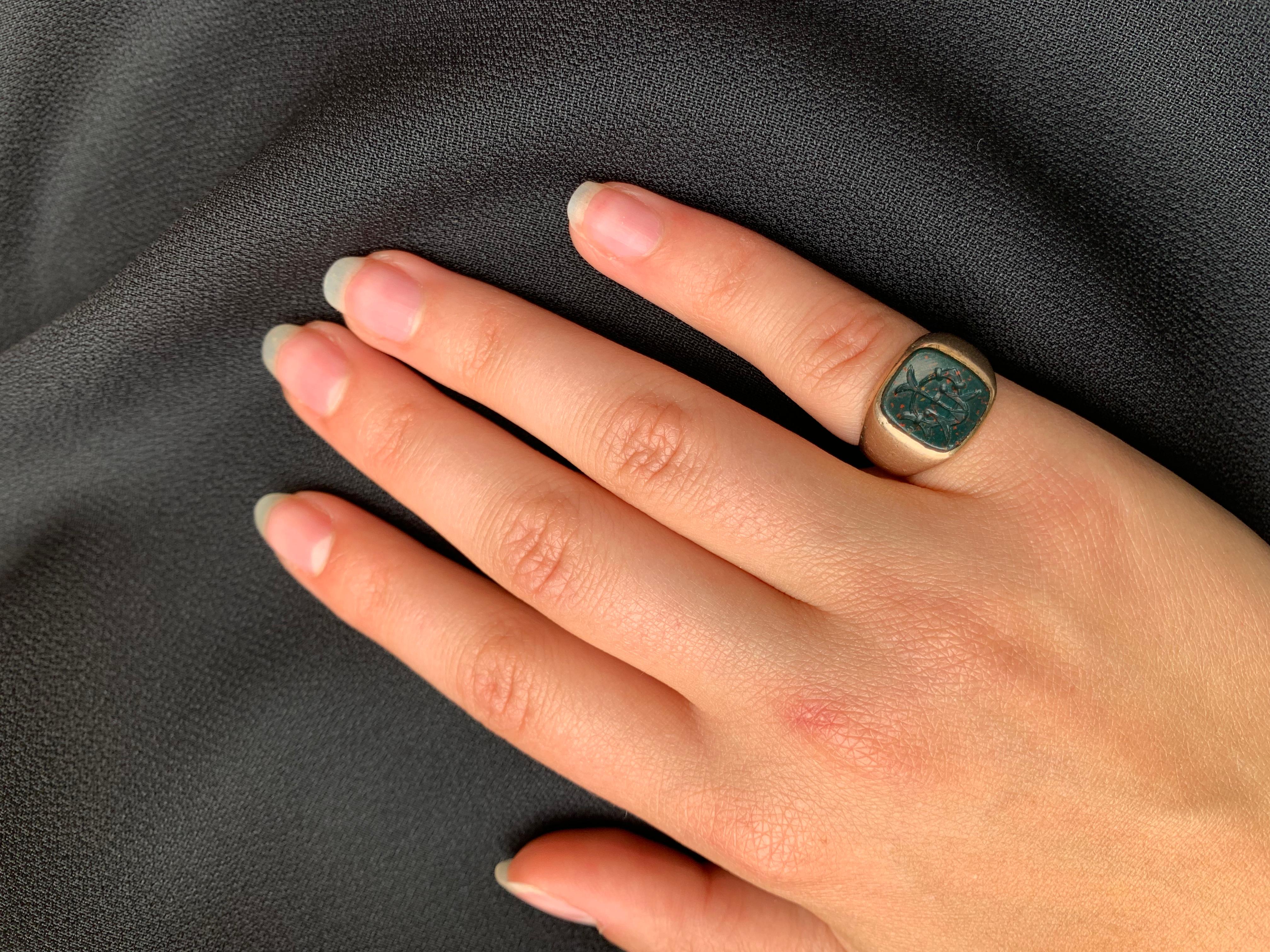 Classic Georgian style antique bloodstone intaglio and 9K rose gold signet ring.
Late 19th Century
The bloodstone intaglio of interconnected symbols and the letter W or M, depending on how you choose to wear it, set in a substantial solid rose gold