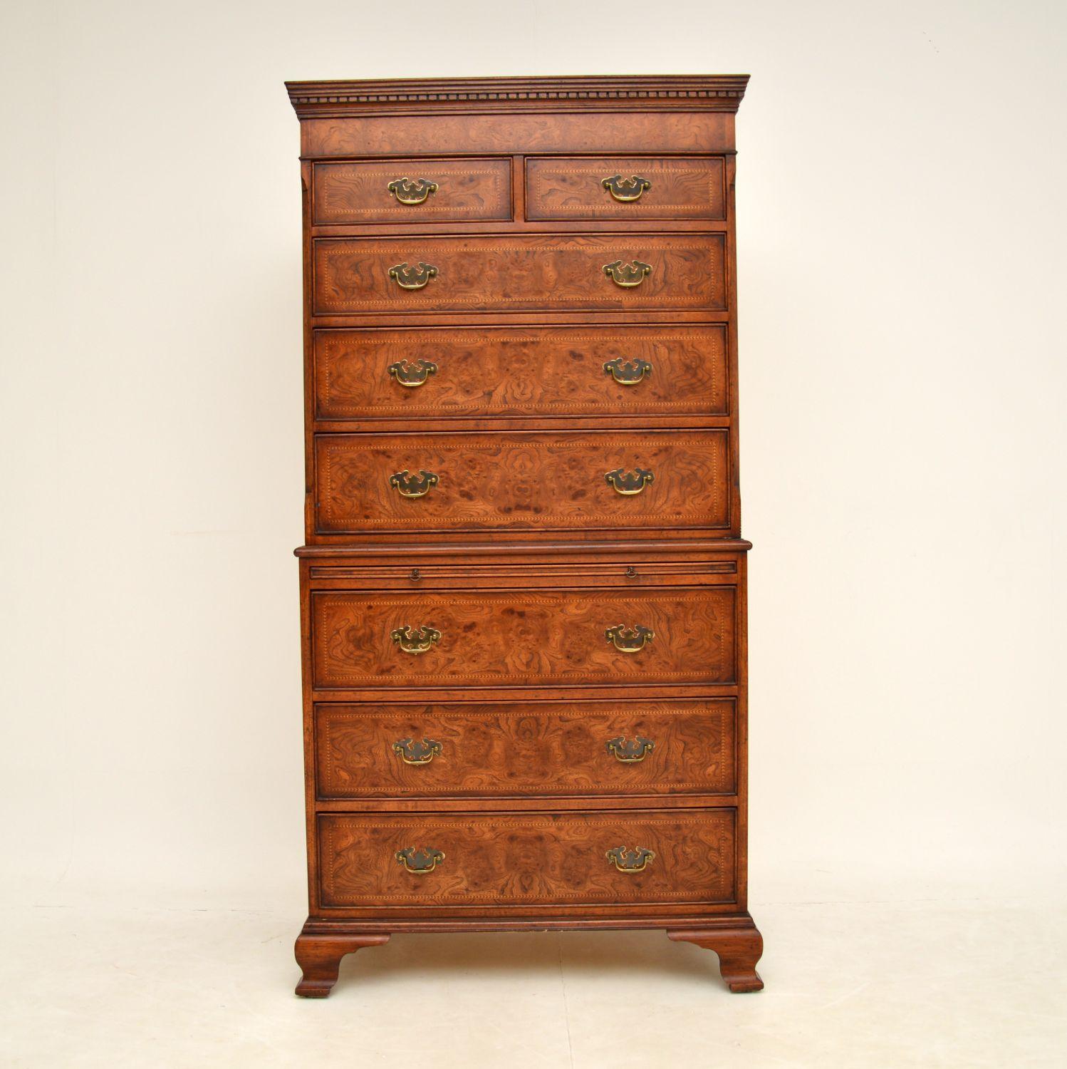 A magnificent burr elm chest on chest, in the antique Georgian style. This was made in England, it dates from around the 1950’s period.

The quality is amazing, this has stunning burr elm grain patterns and fine herringbone inlay around the drawer