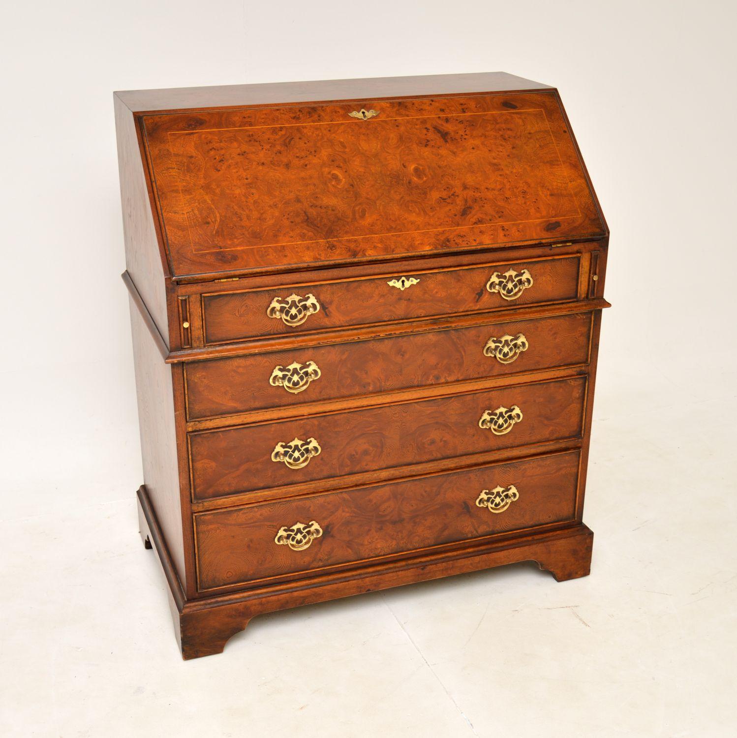 A stunning antique burr elm writing bureau in the Georgian style. This was made in England, it dates from around the 1950’s.

The quality is outstanding, this is extremely well made with stunning burr elm grain patterns. Inside the pull down