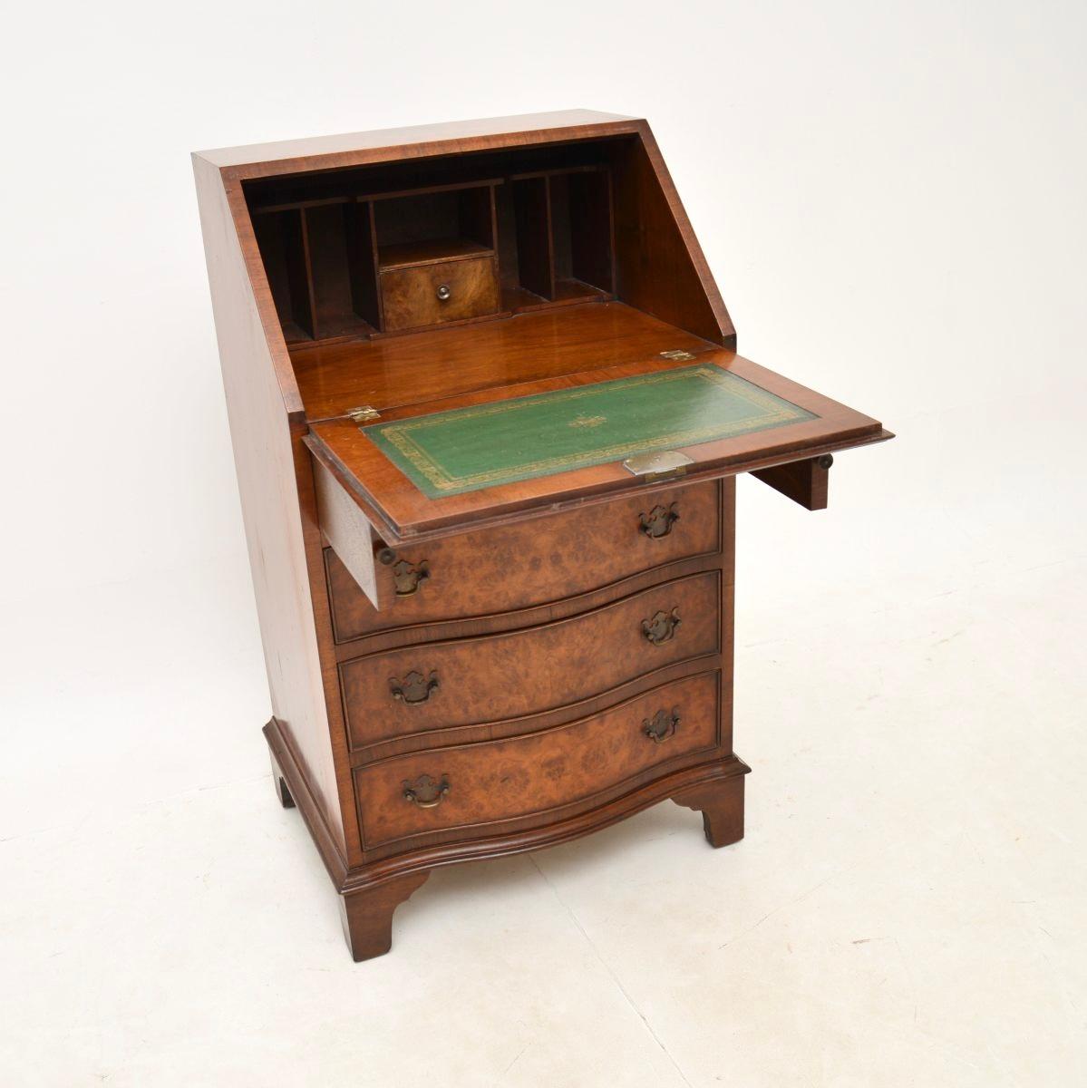 A superb antique Georgian style burr walnut bureau. This was made in England, it dates from around the 1950’s.

The quality is outstanding, this is a lovely slim size, with lots of work space and storage space in the drawers below. The burr walnut