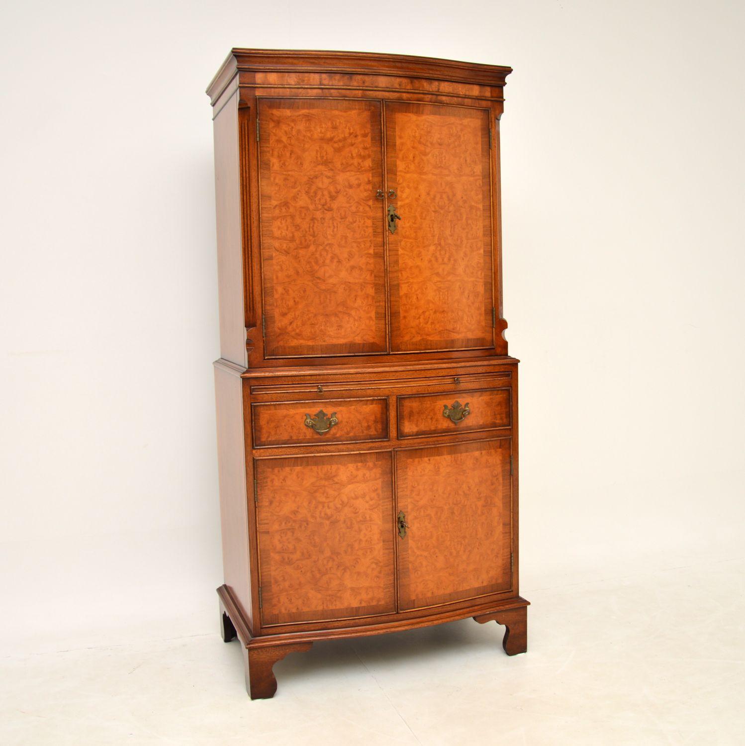 A very well made burr walnut cupboard on cupboard, in the antique Georgian style. This was made in England & dates from around the 1950’s period.

It is of excellent quality, with stunning burr walnut grain patterns and of a very solid build. The