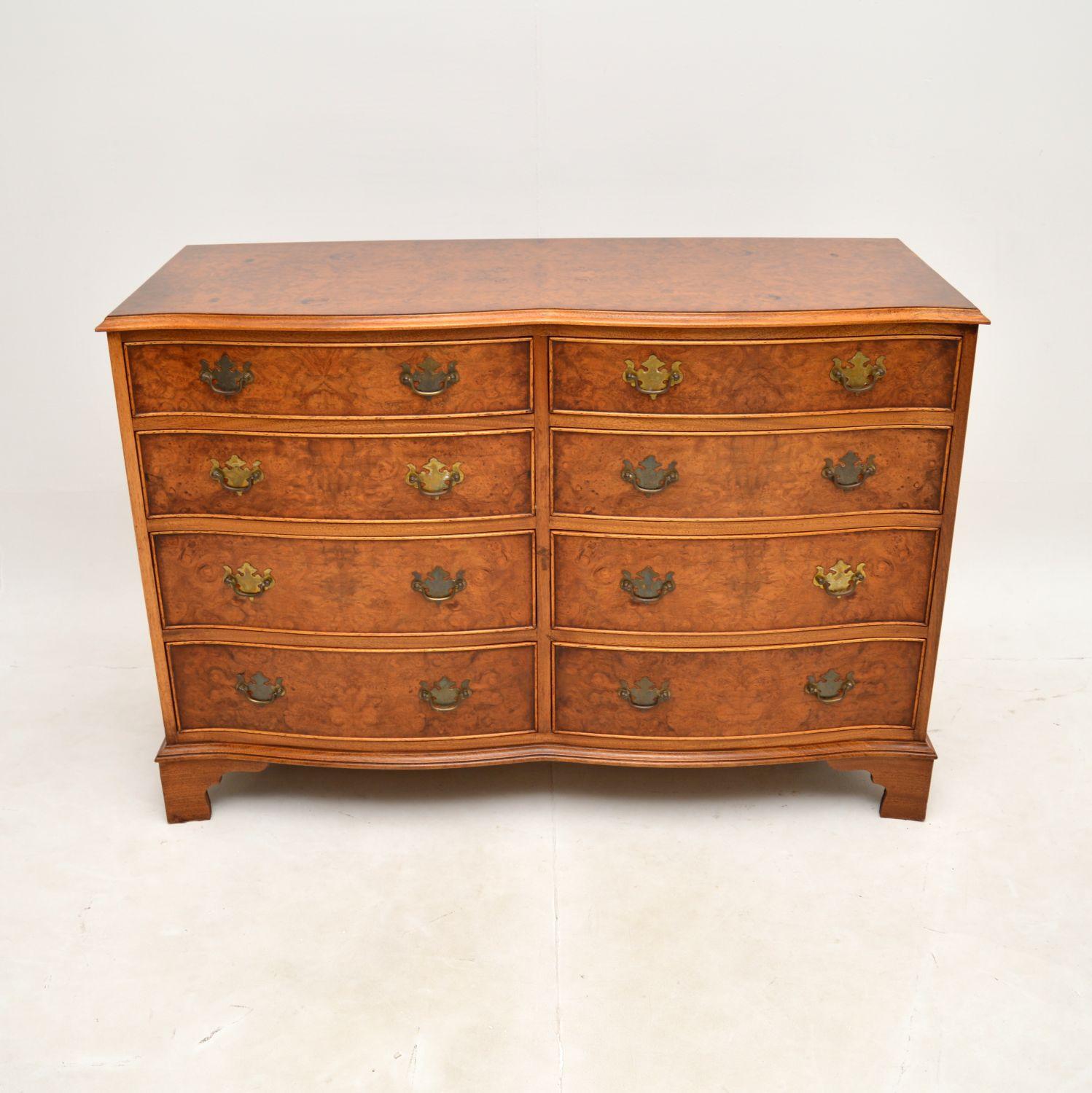A beautiful and extremely well made antique Georgian style burr walnut chest of drawers / sideboard. This was made in England, it dates from around the 1930’s.

It is of superb quality, with fantastic design. There are two banks of bow fronted