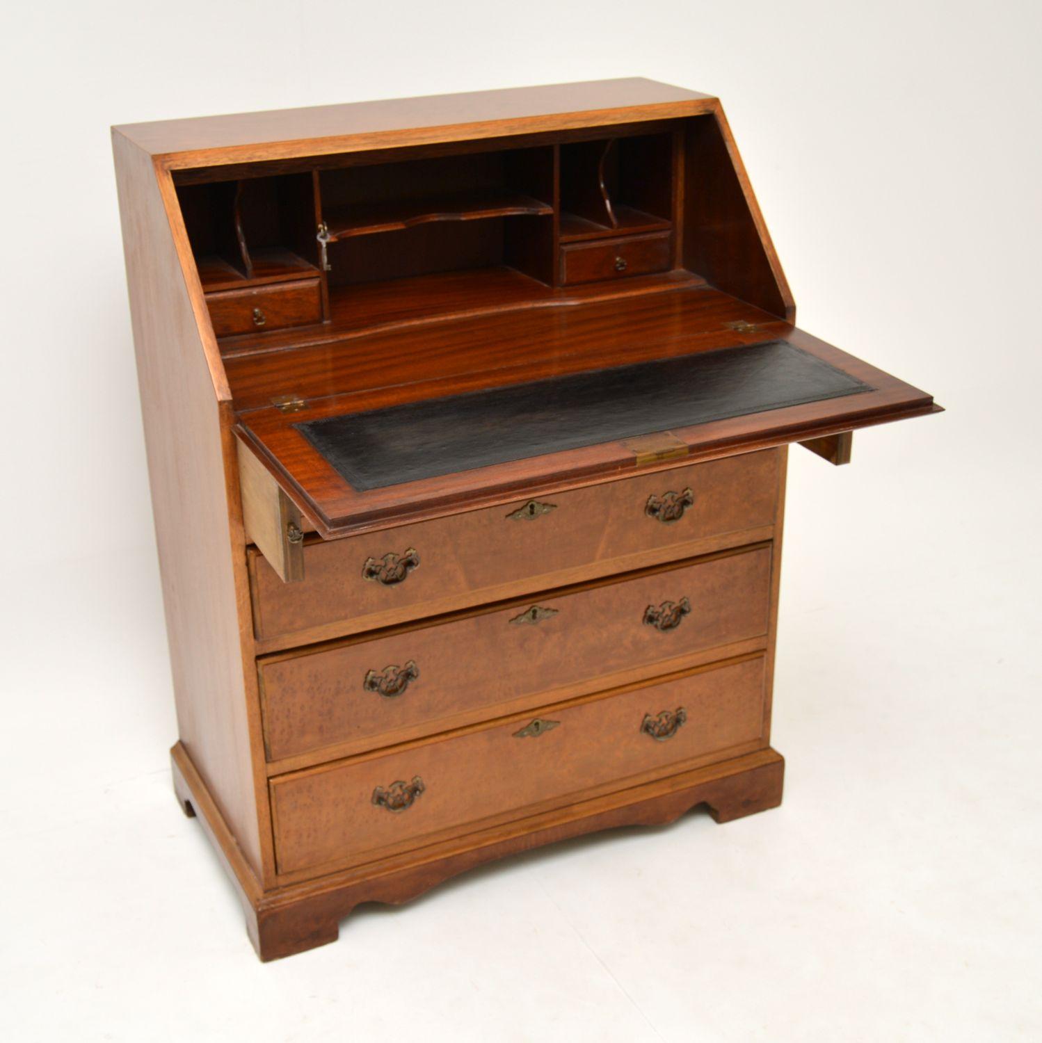 A smart and useful antique writing bureau, beautifully made from walnut. This is in the antique Georgian style, it dates from circa 1930s period.

The quality is excellent, this is of a great size and is a really useful piece. There is a generous