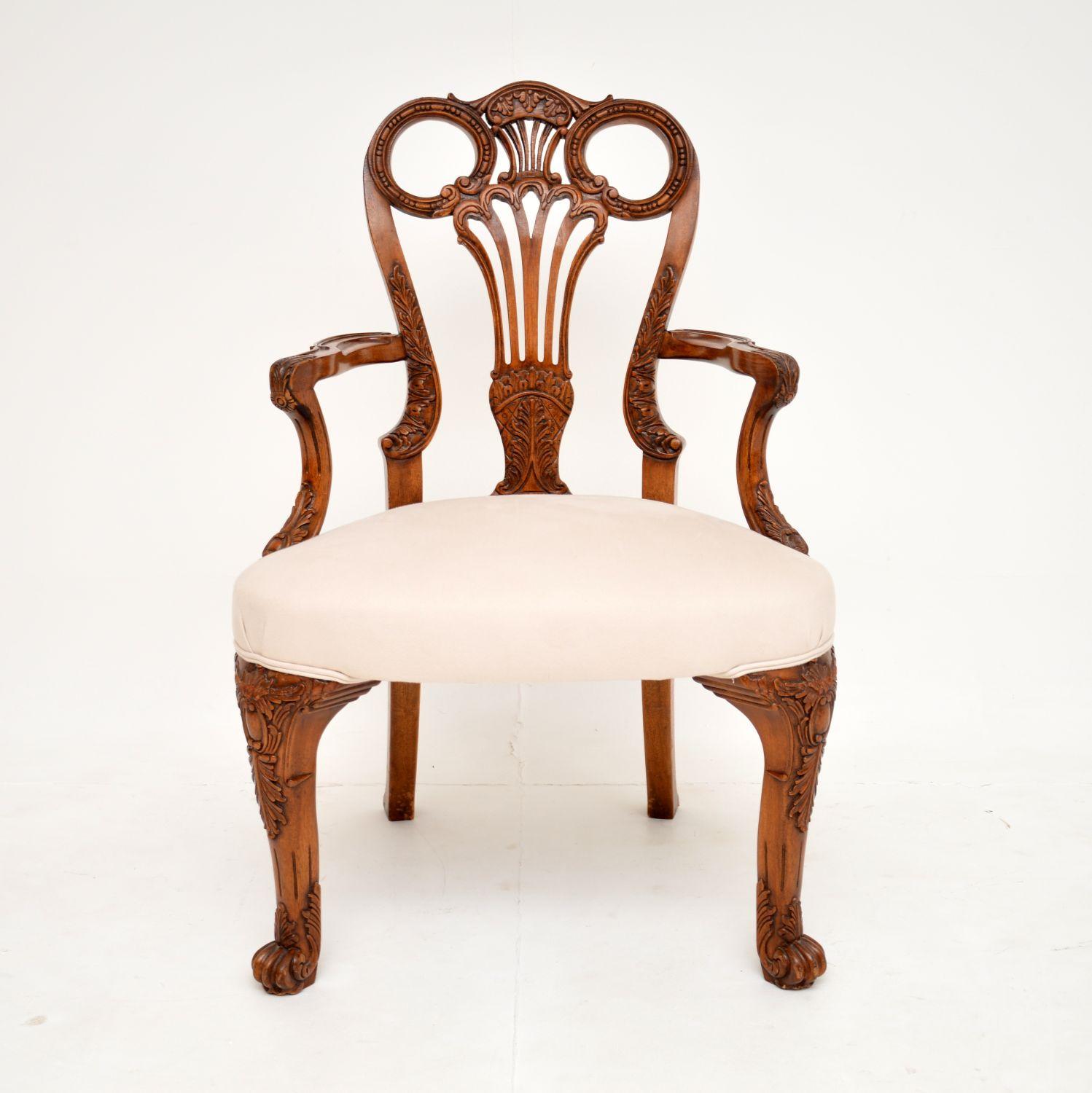 A beautiful and very impressive antique walnut carver armchair dating from around the 1920’s period.

The quality is superb, this has fine and intricate carvings throughout. The pierced back has a lovely shape, this has shepherds crook armrests and