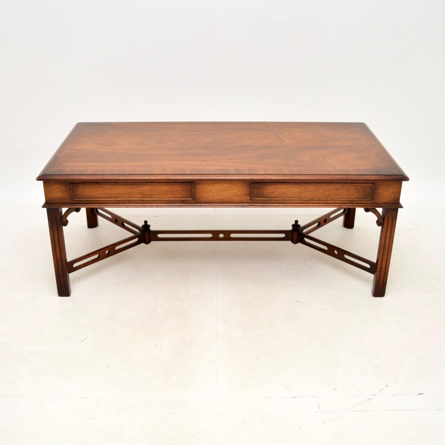 A large and impressive antique Georgian style coffee table. This was made in England, it dates from around the 1950’s.

The quality is superb, this is a great size and has drawers that slide out from either end. It has a large surface area with a