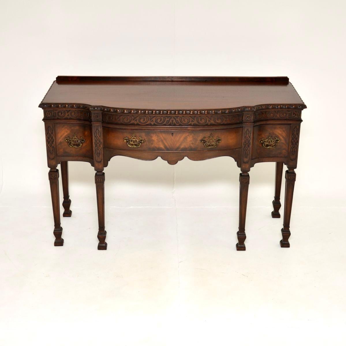 A wonderful antique console / server table, made in England and dating from around the 1890-1910 period.

It is of outstanding quality, with gorgeous carving on all the edges. This is an impressive size, the drawers have high quality brass handles