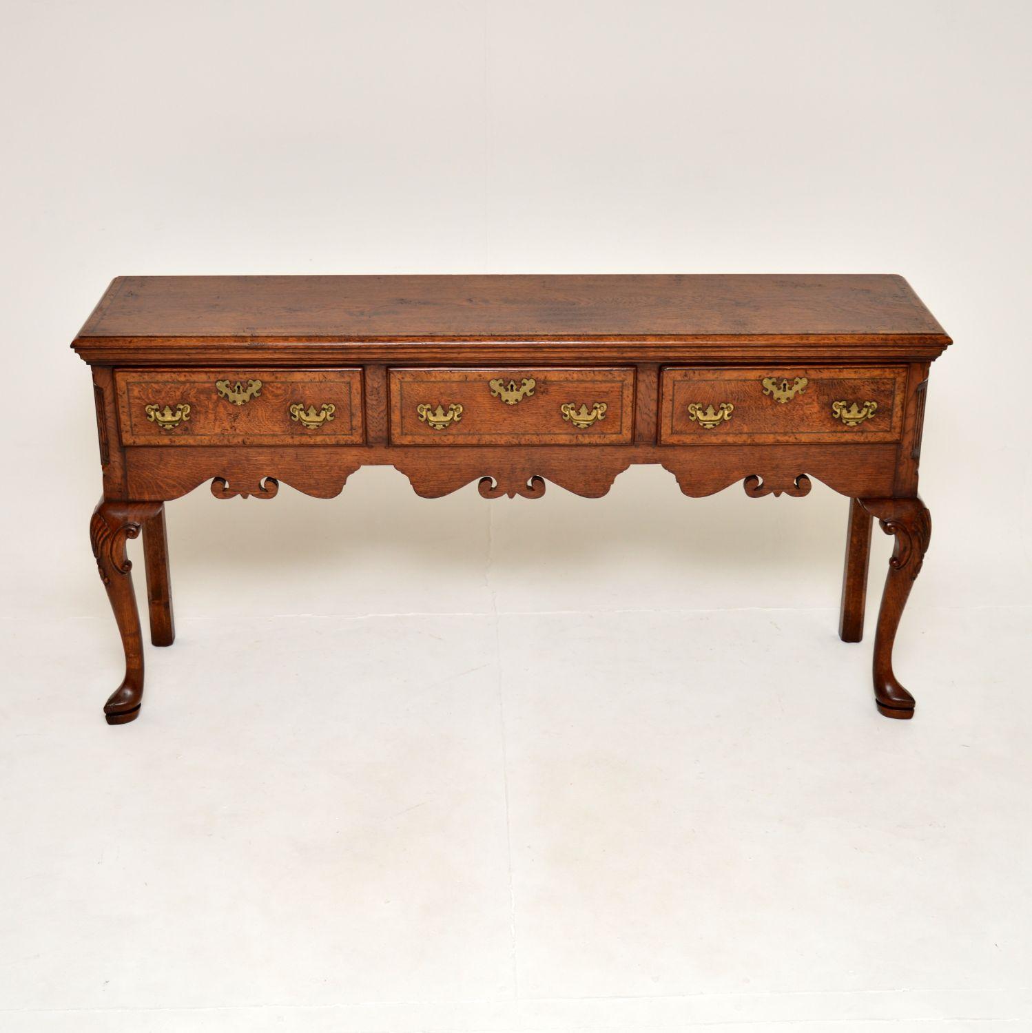 A superb antique Georgian style console / side table in pollard oak. This was made in England, it dates from around the 1950’s. It comes under the category of “Ipswich Oak”, which is well known in the trade to be the best quality hand made furniture