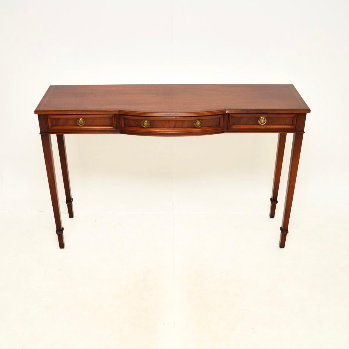 A superb antique Georgian style console table, made in England and dating from around the 1950’s.

This is of beautiful quality and is extremely well made. It is a very useful size, slim from front to back and quite wide, with useful storage space