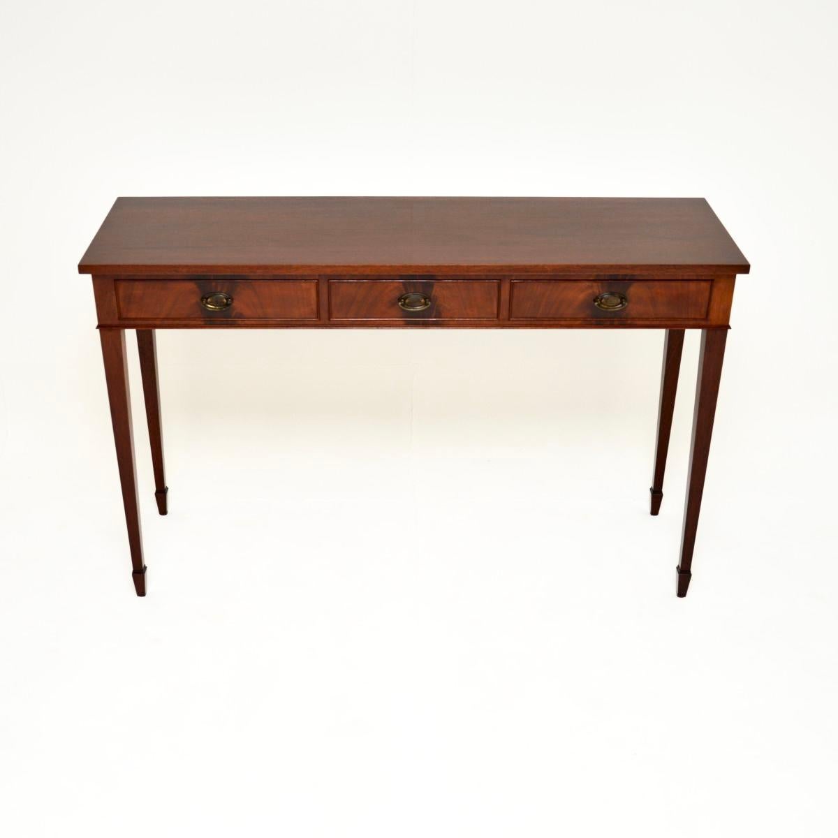 A superb antique Georgian style console table, made in England and dating from around the 1950’s.

This is of beautiful quality and is extremely well made. It is a very useful size, slim from front to back and quite wide, with useful storage space