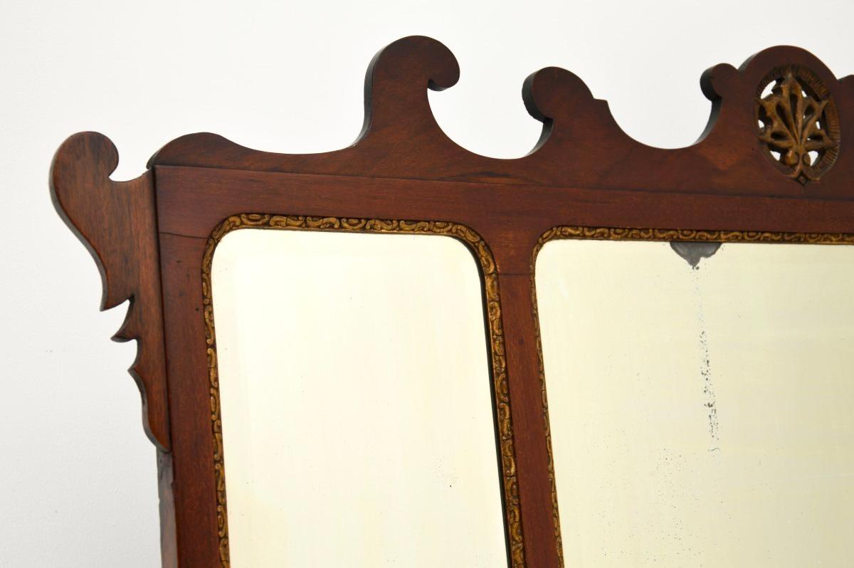 A large and impressive antique parcel gilt overmantle mirror. This was made in England, it likely dates from around the 1890-1900 period.

It is of very fine quality, with beautifully carved fretwork around the top edges and gorgeous pierced parcel