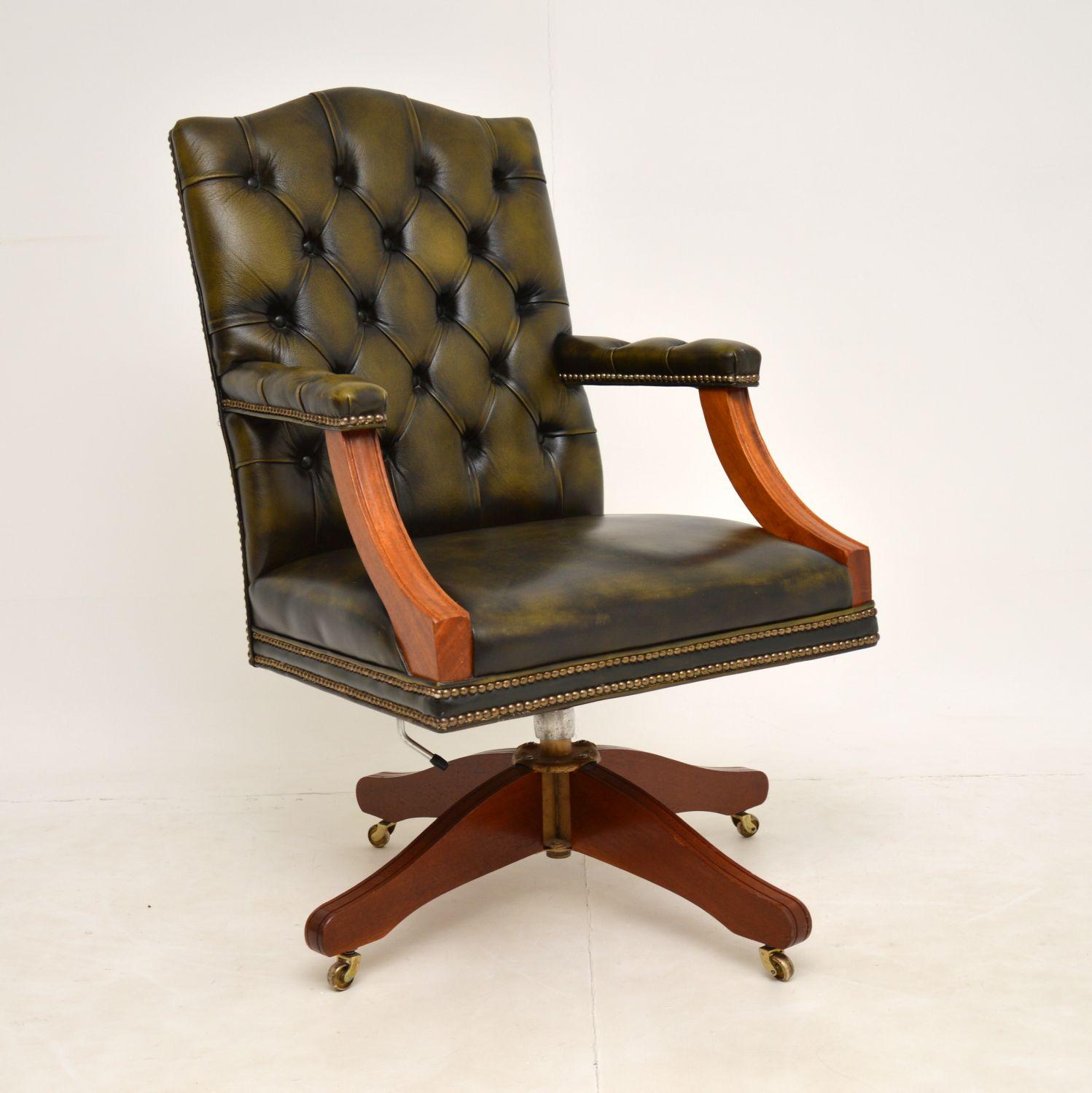 A fantastic leather swivel desk chair in the antique Georgian style. This dates from the mid twentieth century, around the 1960-70’s and is of very high quality.

It is extremely comfortable, it tilts, swivels and rolls on brass casters. The rise