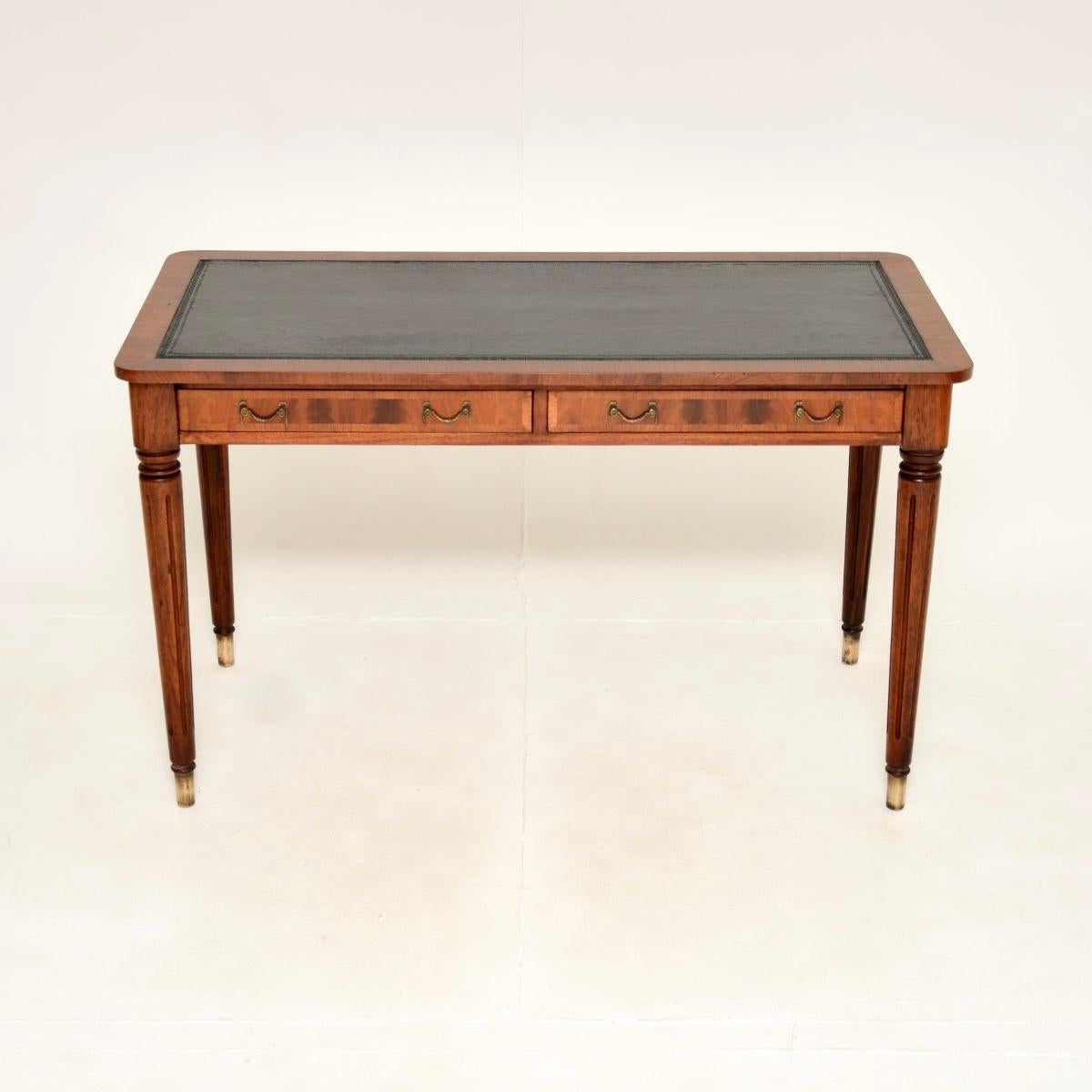 A smart and beautifully designed antique Georgian style leather top writing table / desk. This was made in England, we would date it to around the mid-late twentieth century.

It is of lovely quality and is a very useful size. There is an inset
