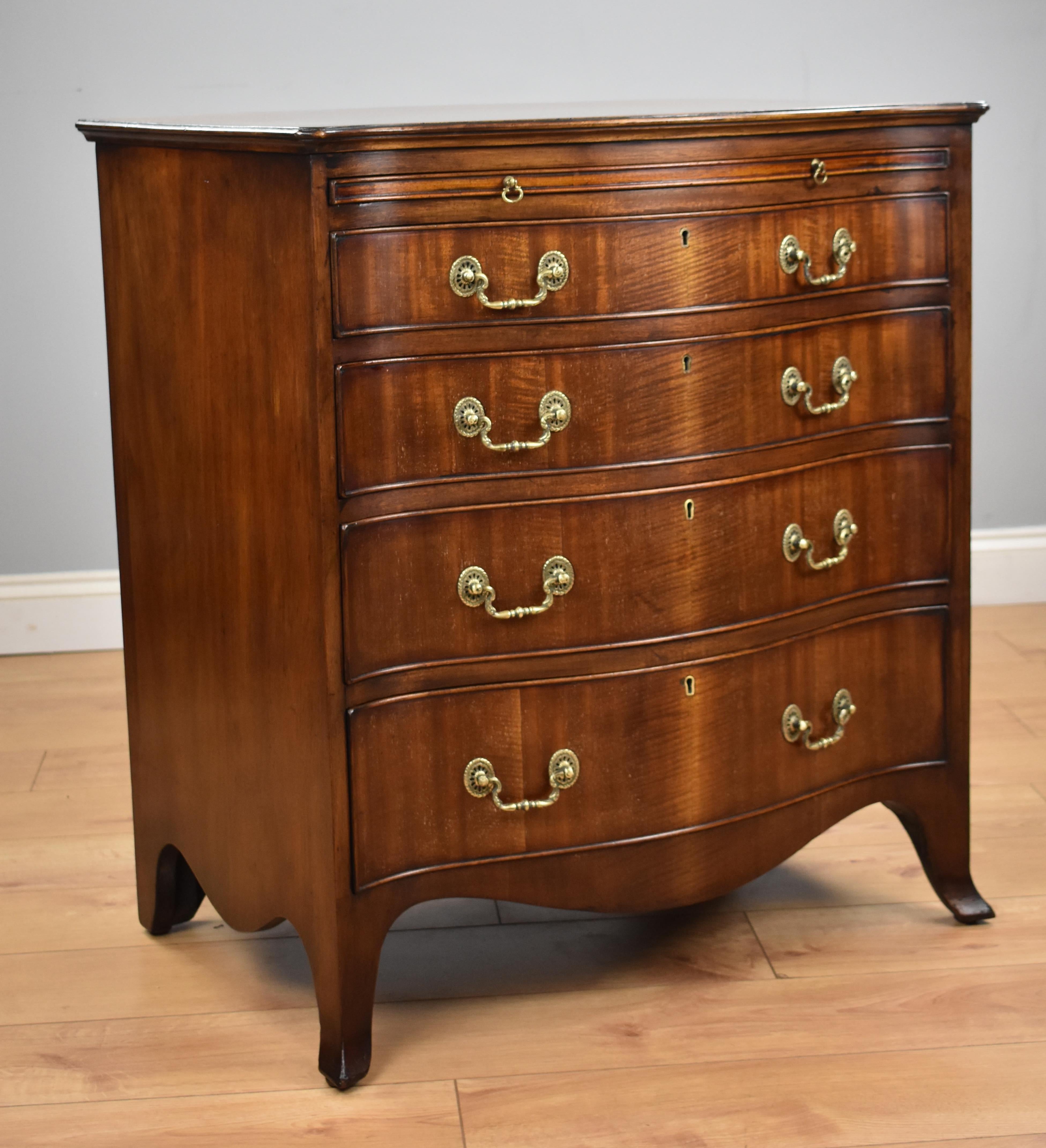 Antique Georgian style mahogany serpentine fronted chest drawers in good condition having been recently polished by hand. The chest has a moulded top over brushing slide with four long drawers standing on apron base with splayed feet.