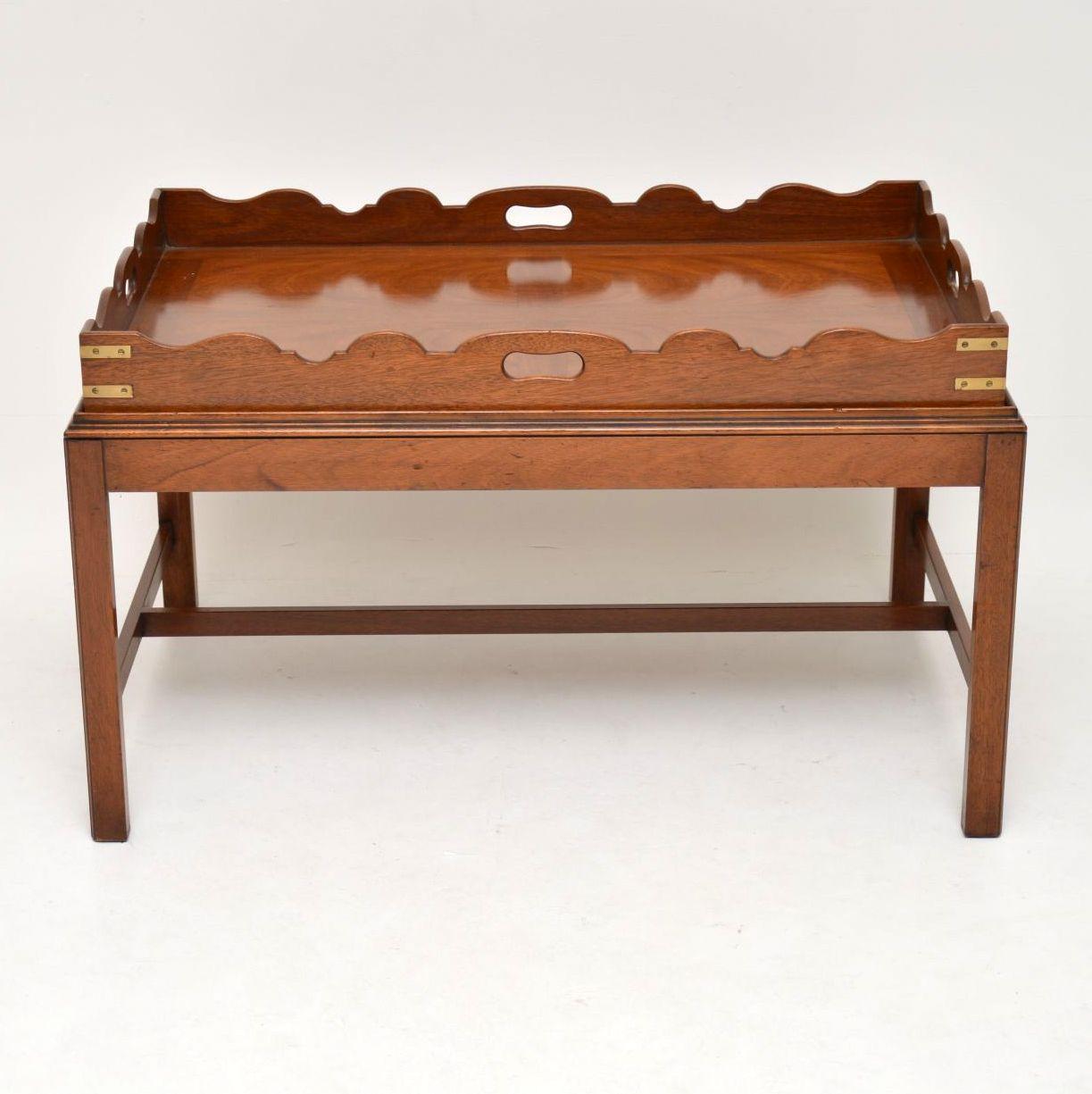 Antique George III style mahogany tray top coffee table dating from the 1930s period. It’s high quality, in excellent condition and has just been French polished. The tray top can be just lifted off and used for carrying items. It has inset handles