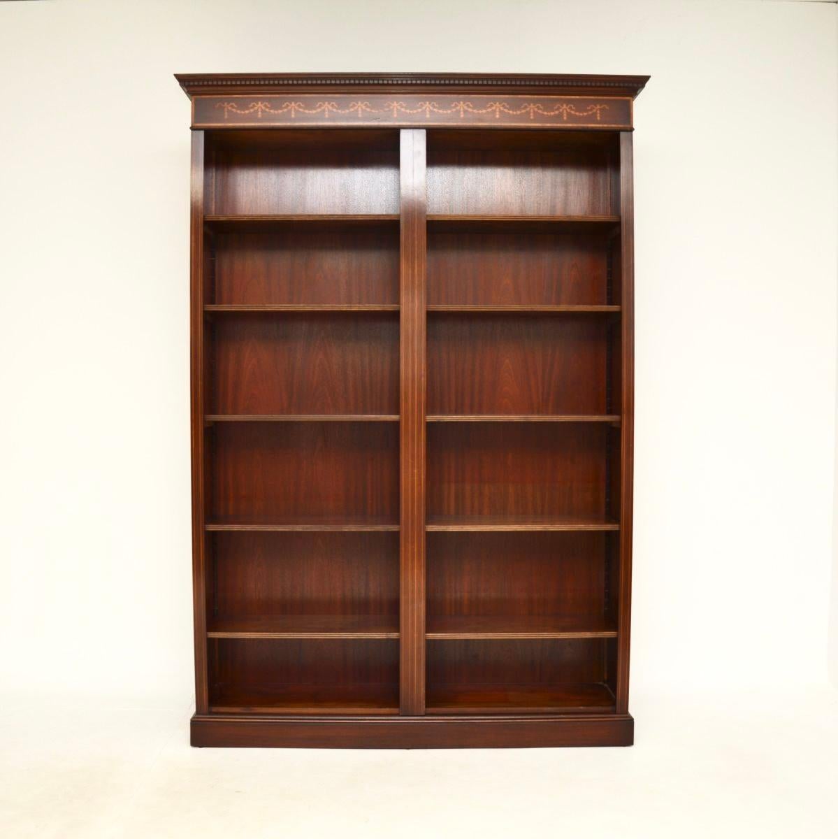 A large and impressive antique Georgian style open bookcase. This was made in England, it dates from around the 1950’s.

It is of superb quality and is a very useful size. It is very large and has lots of storage space, yet is not too deep and