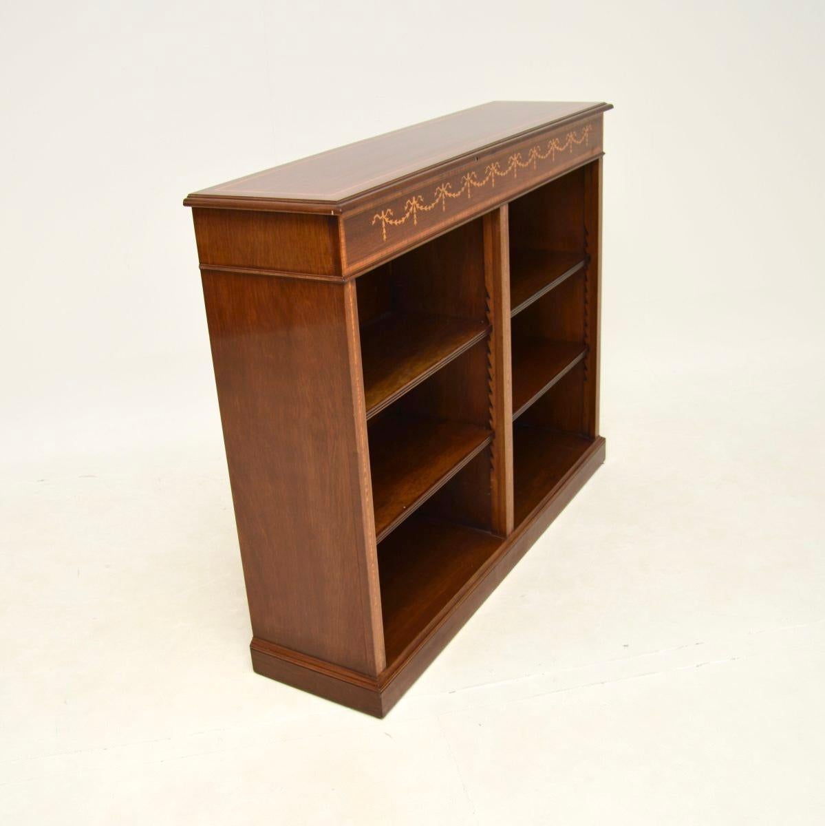 An impressive antique Georgian style open bookcase. This was made in England, it dates from around the 1950’s.

It is of superb quality and is a very useful size. It has lots of storage space in the two open sections, yet is not too deep and