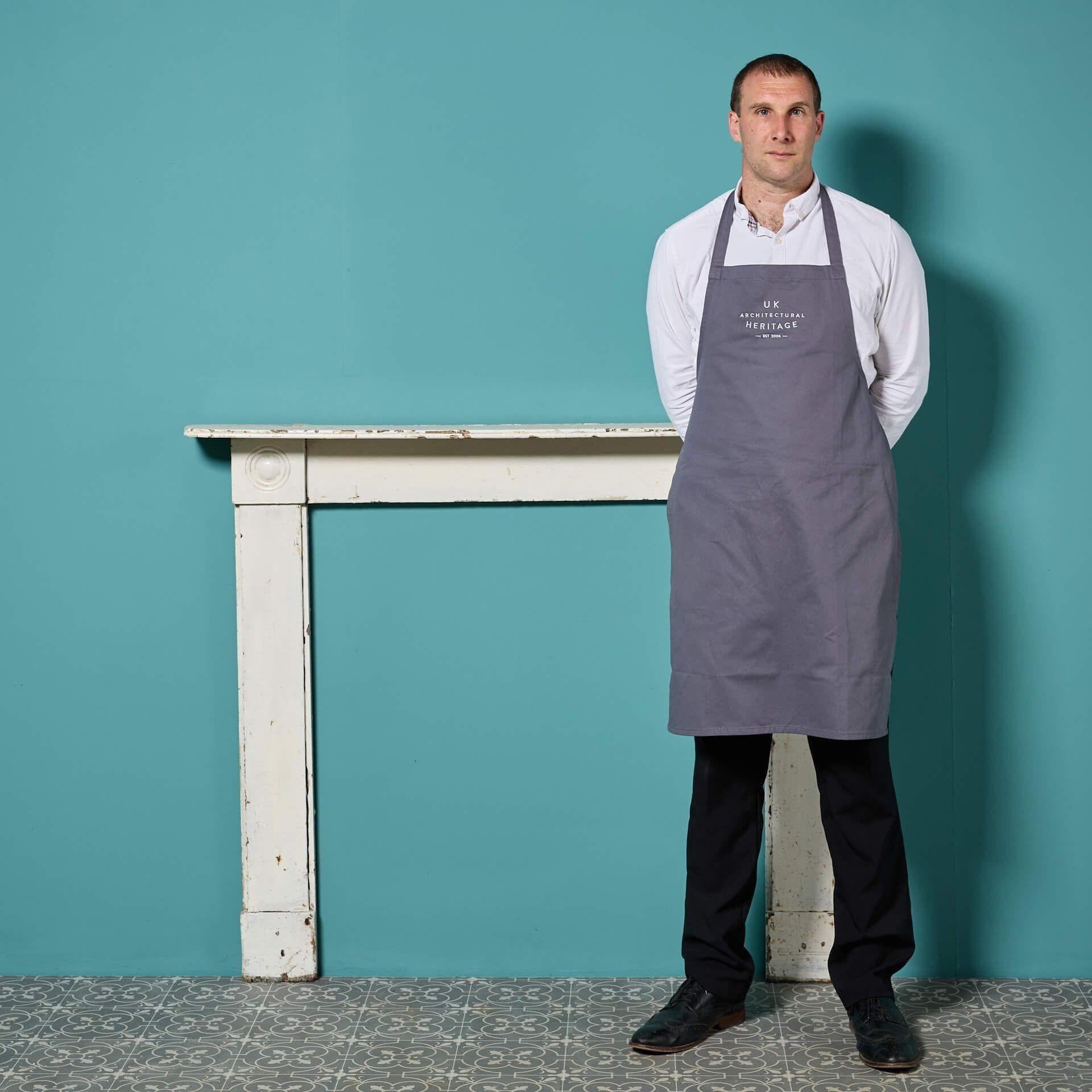 An antique Georgian style painted pine bullseye fireplace with a charming old, distressed paint finish.

This antique fireplace was removed from a property originating from circa 1776, but is believed to be a later addition, possibly adapted using