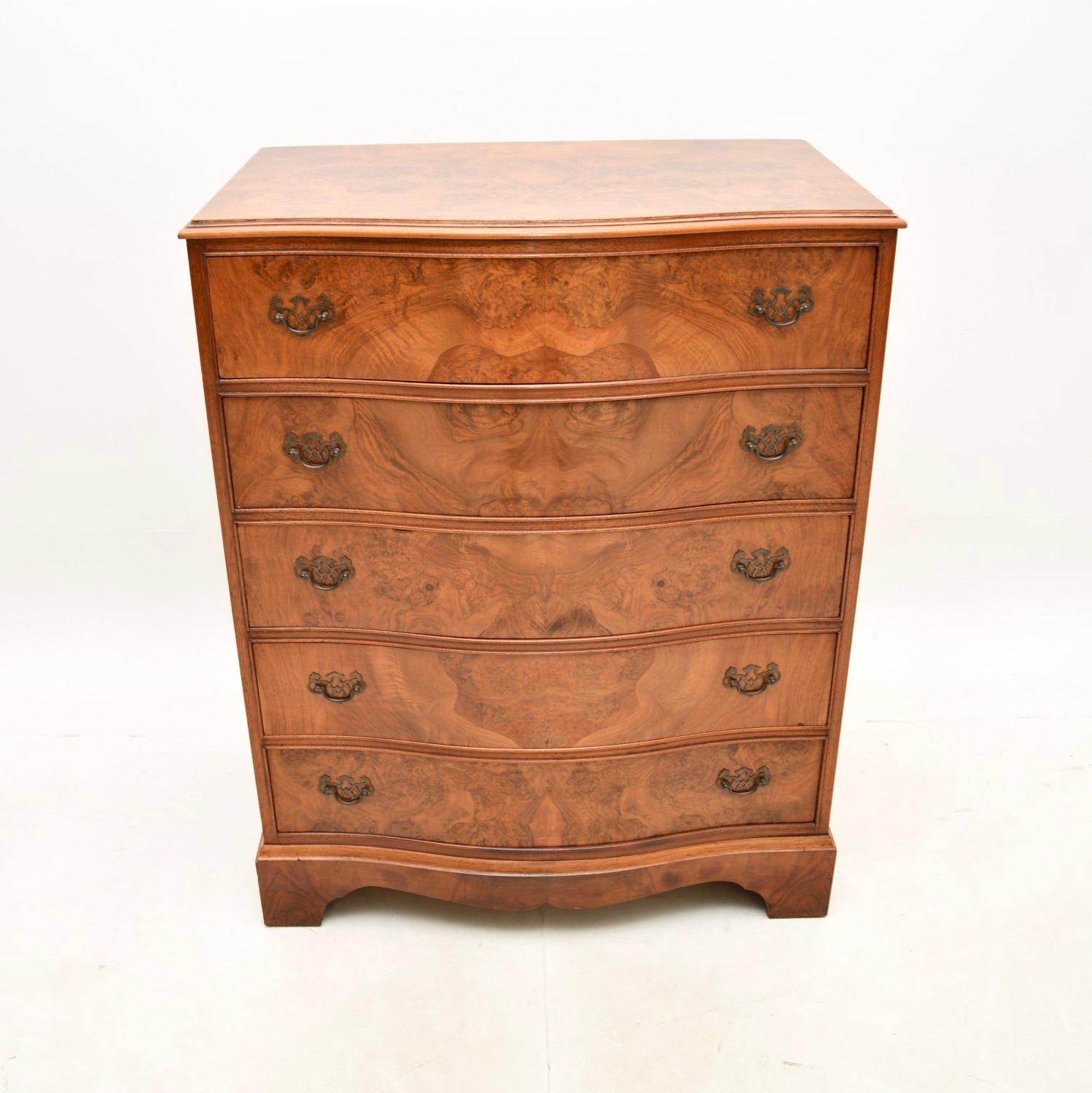 A beautiful and practical antique Georgian style walnut chest of drawers. This was made in England, it dates from around the 1930’s.

The quality is superb, this is a very useful size with lots of storage space inside the five generous drawers. This