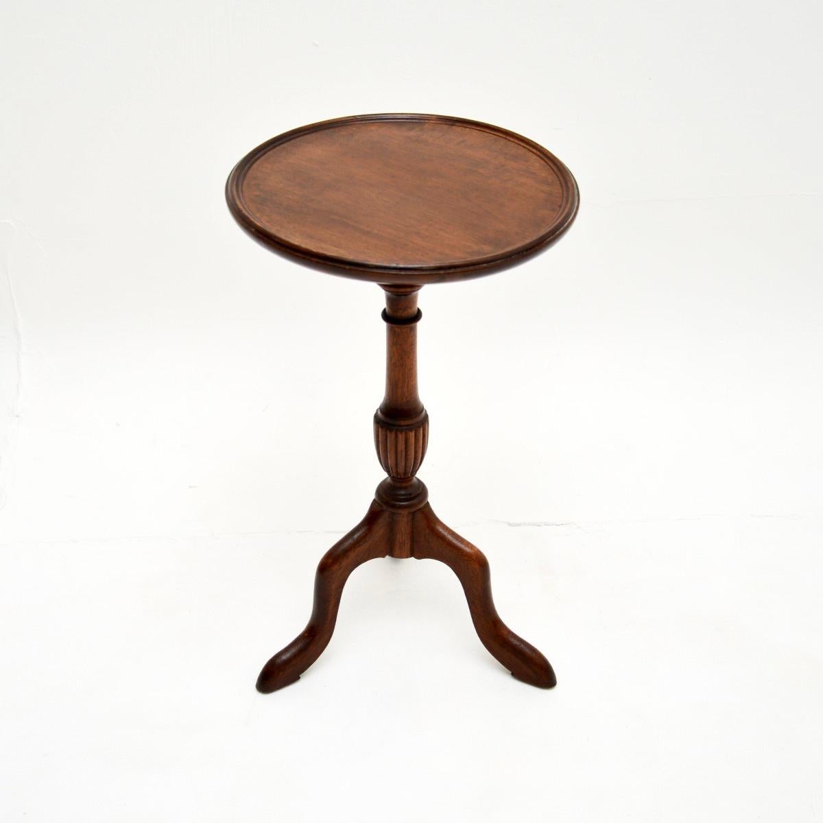 A lovely antique Georgian style wine table. This was made in England, it dates from around the 1930’s.

It is of very good quality and is a very useful item. The circular top has a slightly lipped edges, it sits on an elegant yet sturdy tripod
